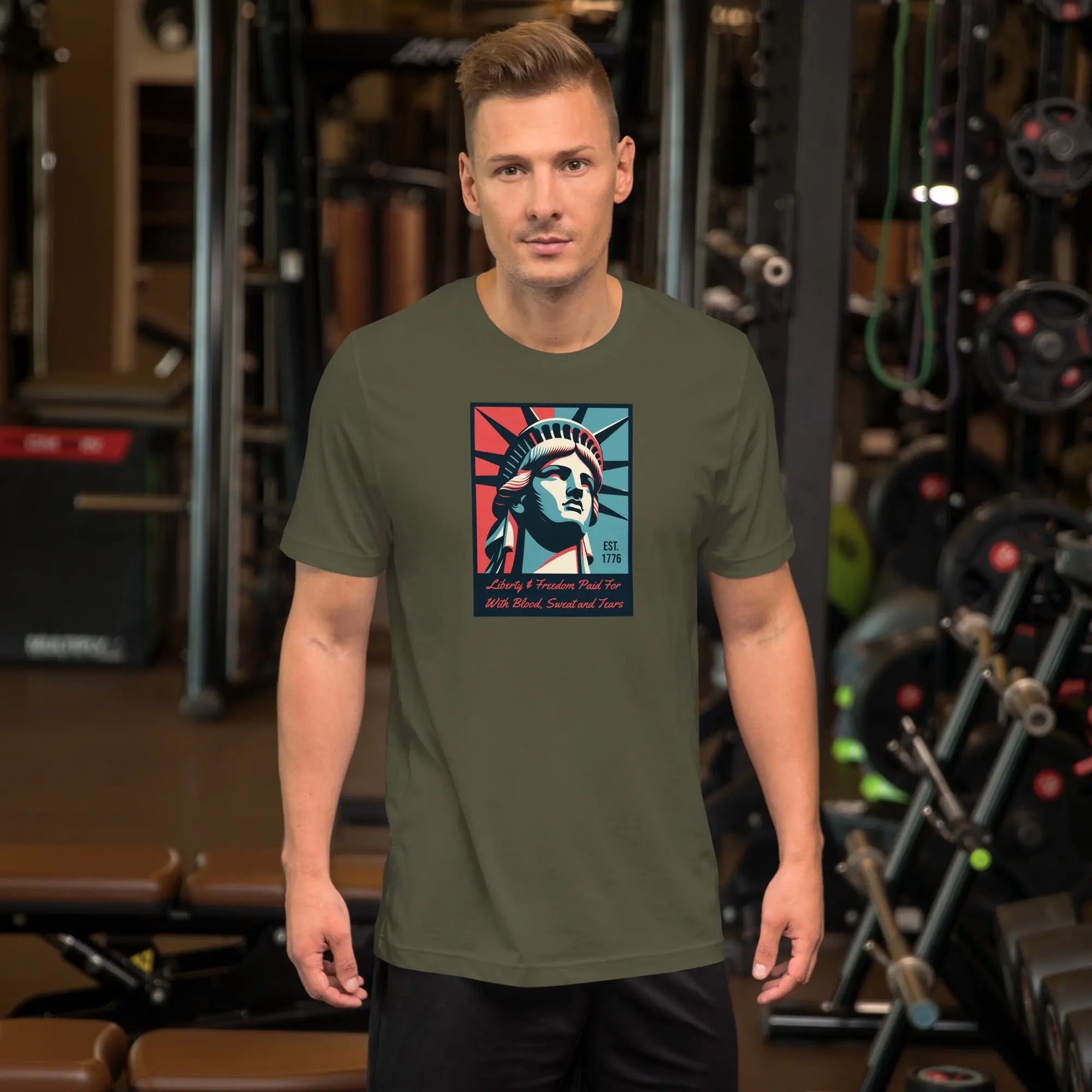 Front of man wearing a military green patriotic t-shirt with a picture of the statue of liberty 