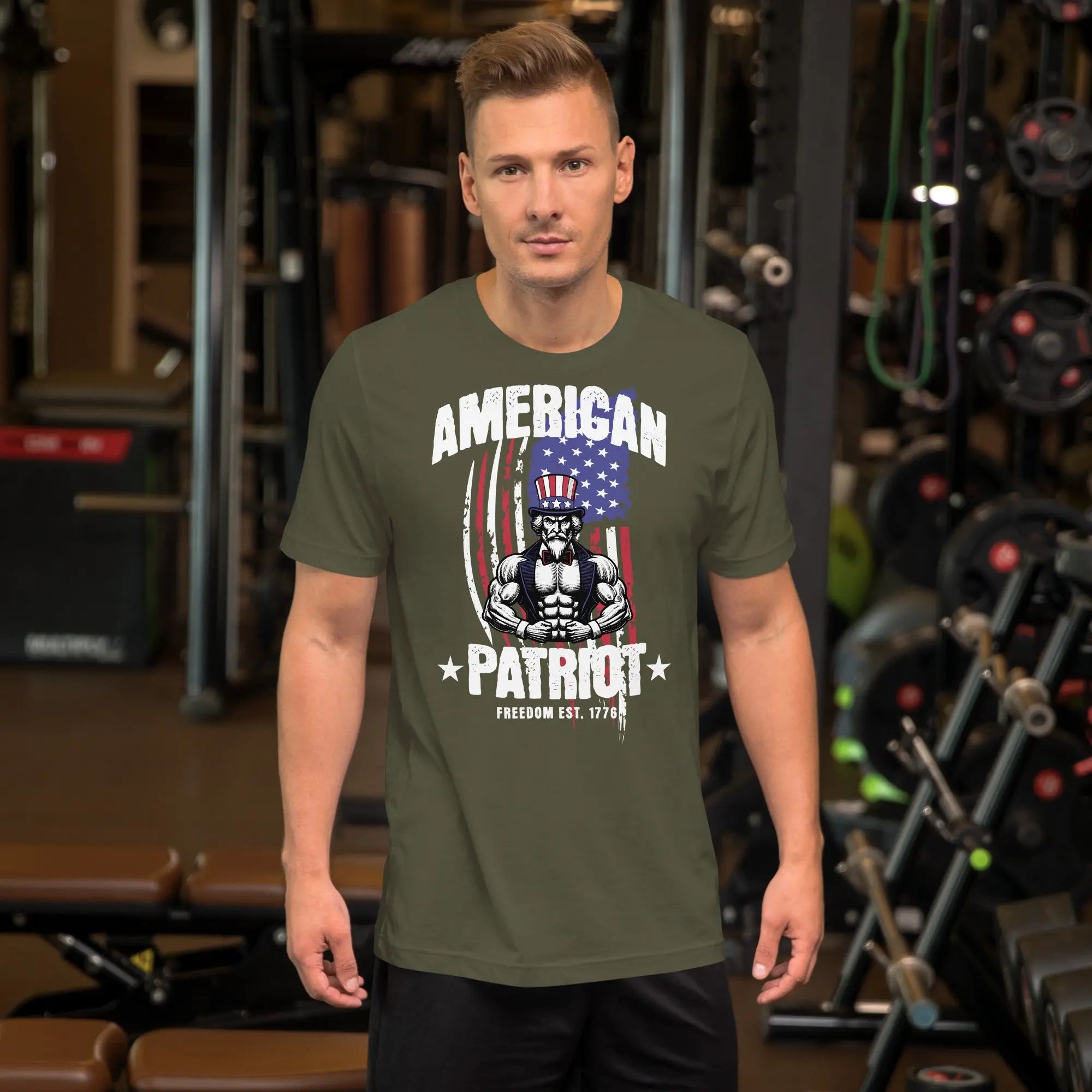 A man wearing a military green patriotic t-shirt with a muscular Uncle Sam with "American Patriot" text.