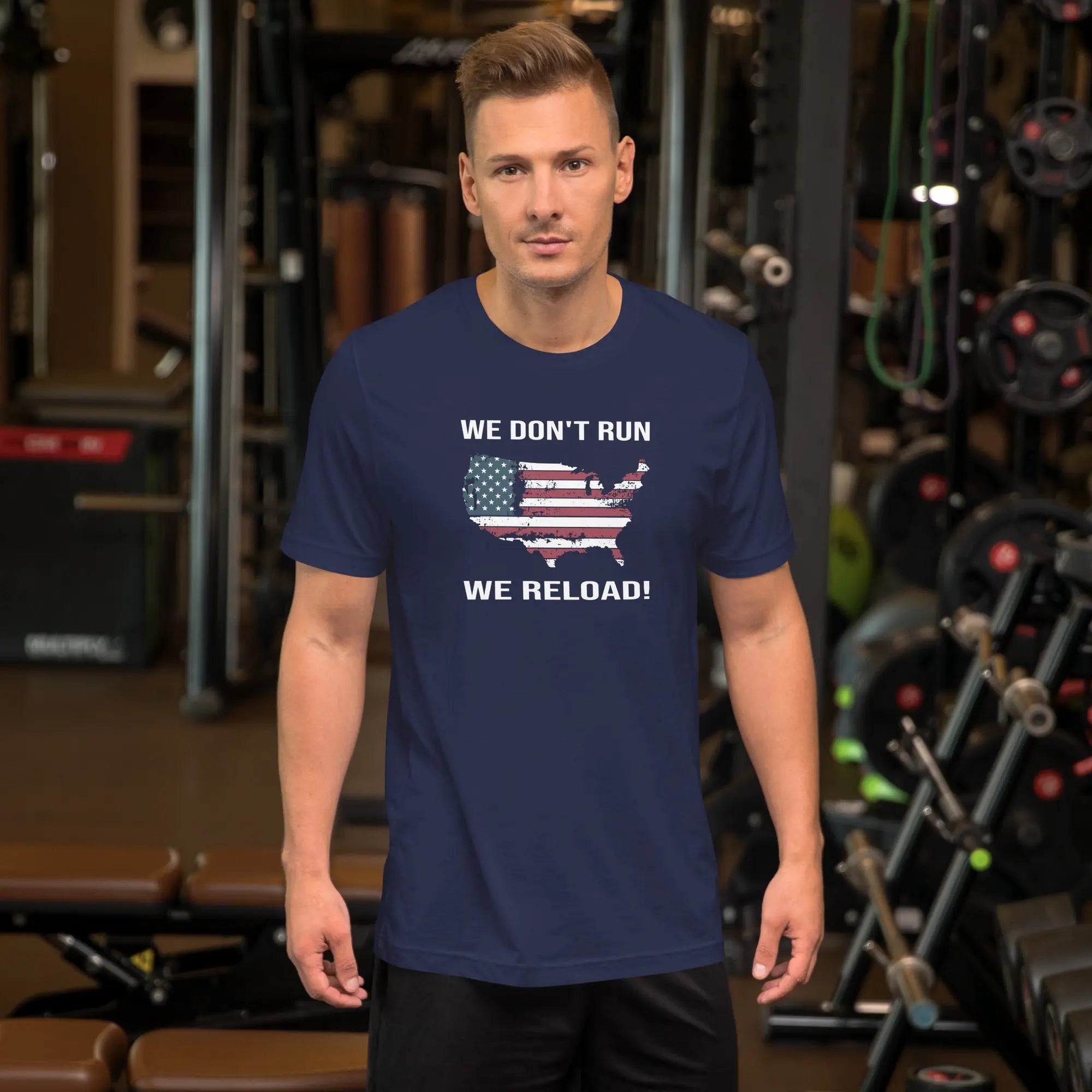 man wearing a navy blue patriotic t-shirt with "We don't run, we reload" text.