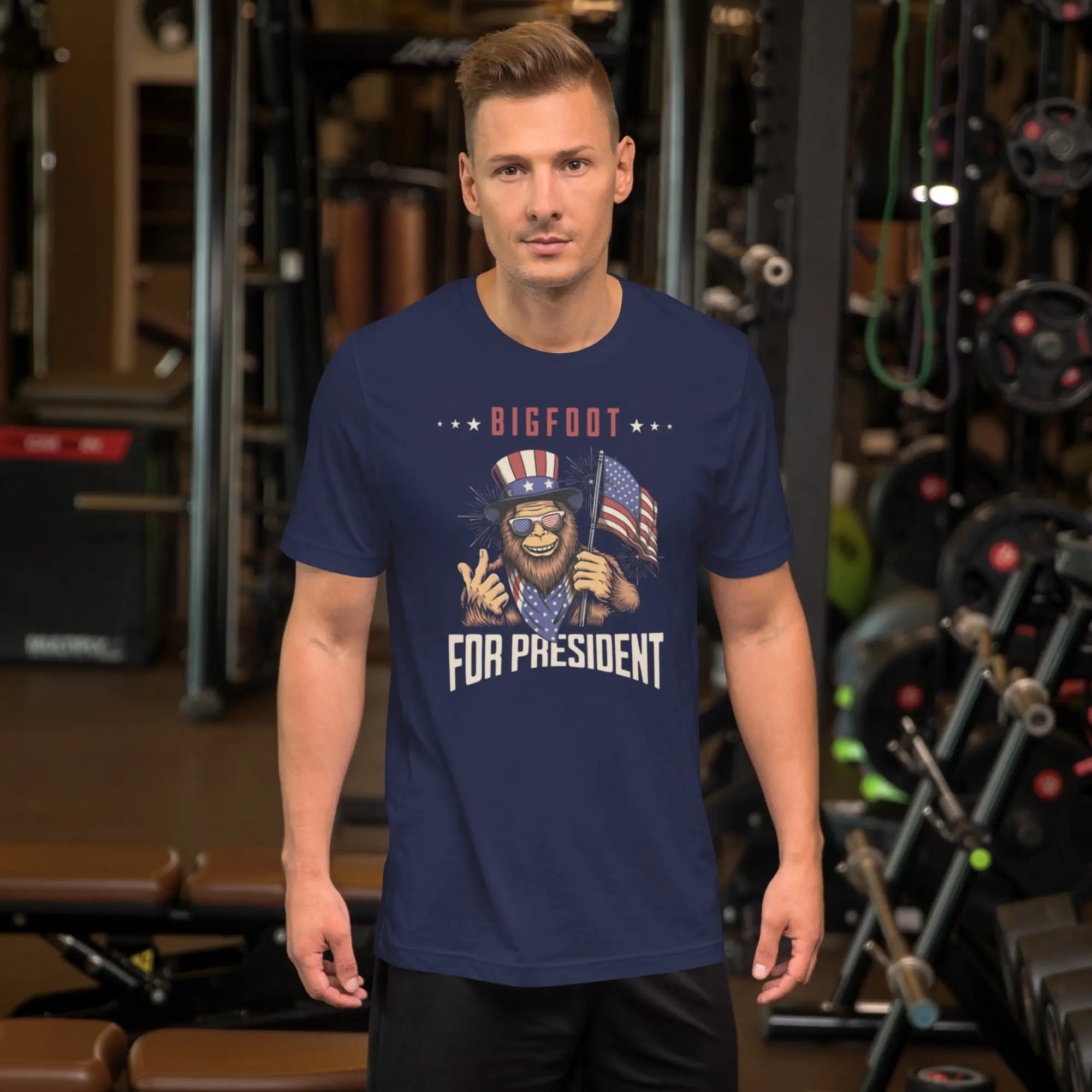 man wearing a navy patriotic t-shirt with a image of bigfoot with "Bigfoot for president" text