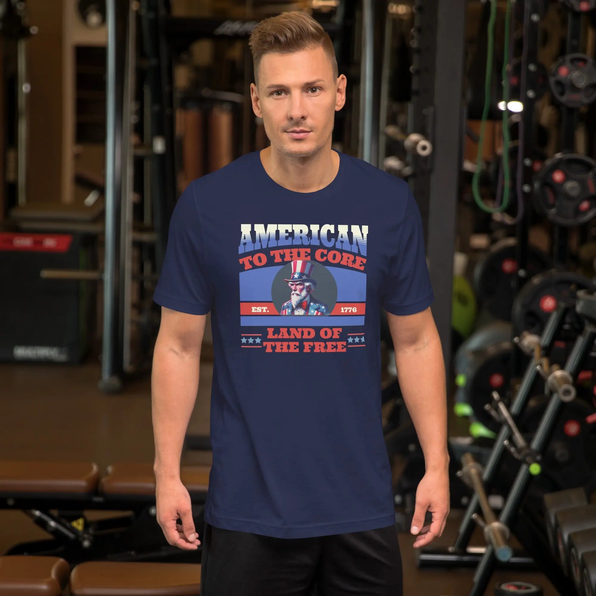 A man wearing a navy patriotic t-shirt with an image of Uncle Sam and "Land of the Free" text.