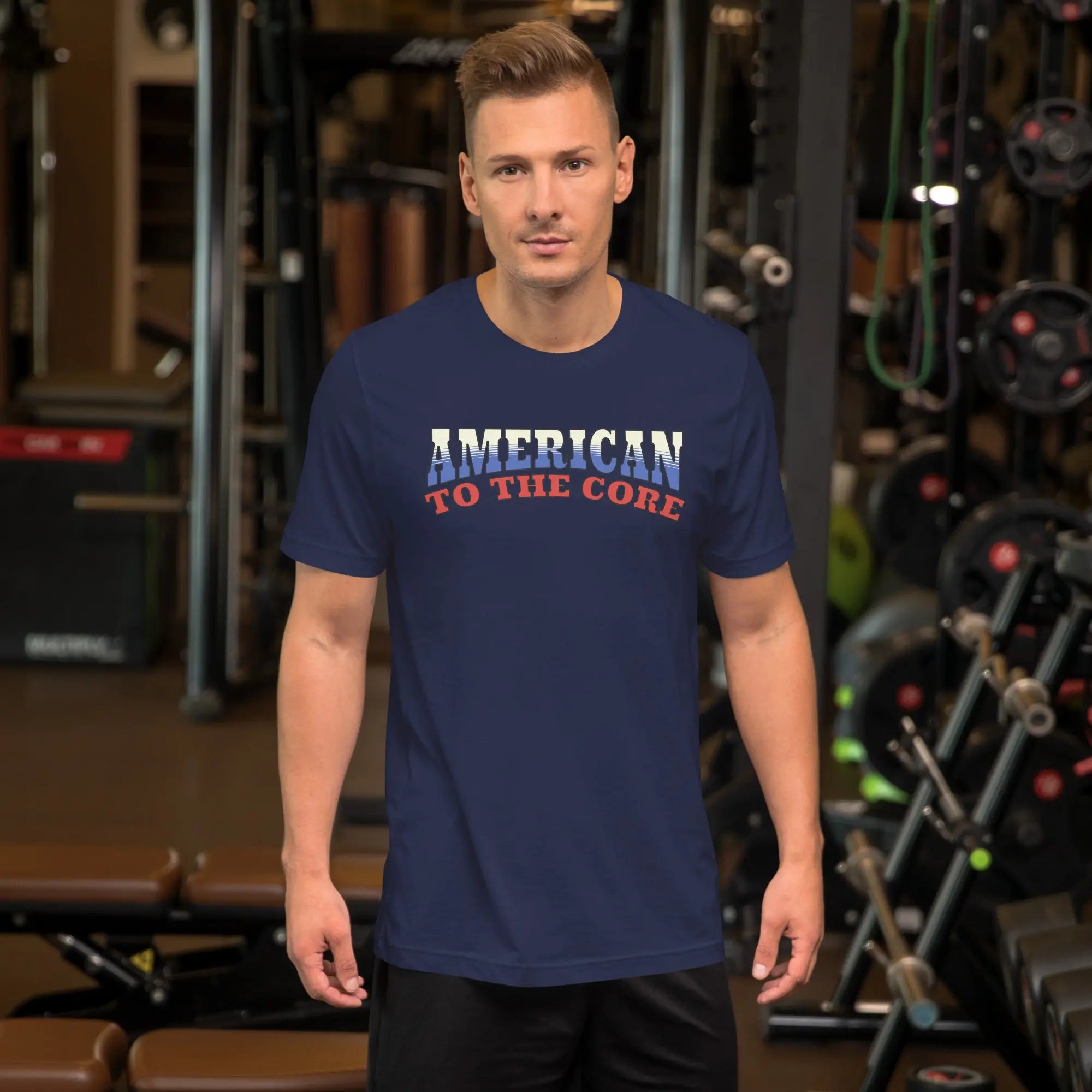 A man wearing a navy patriotic t-shirt with "America to the core" text in red, white and blue
