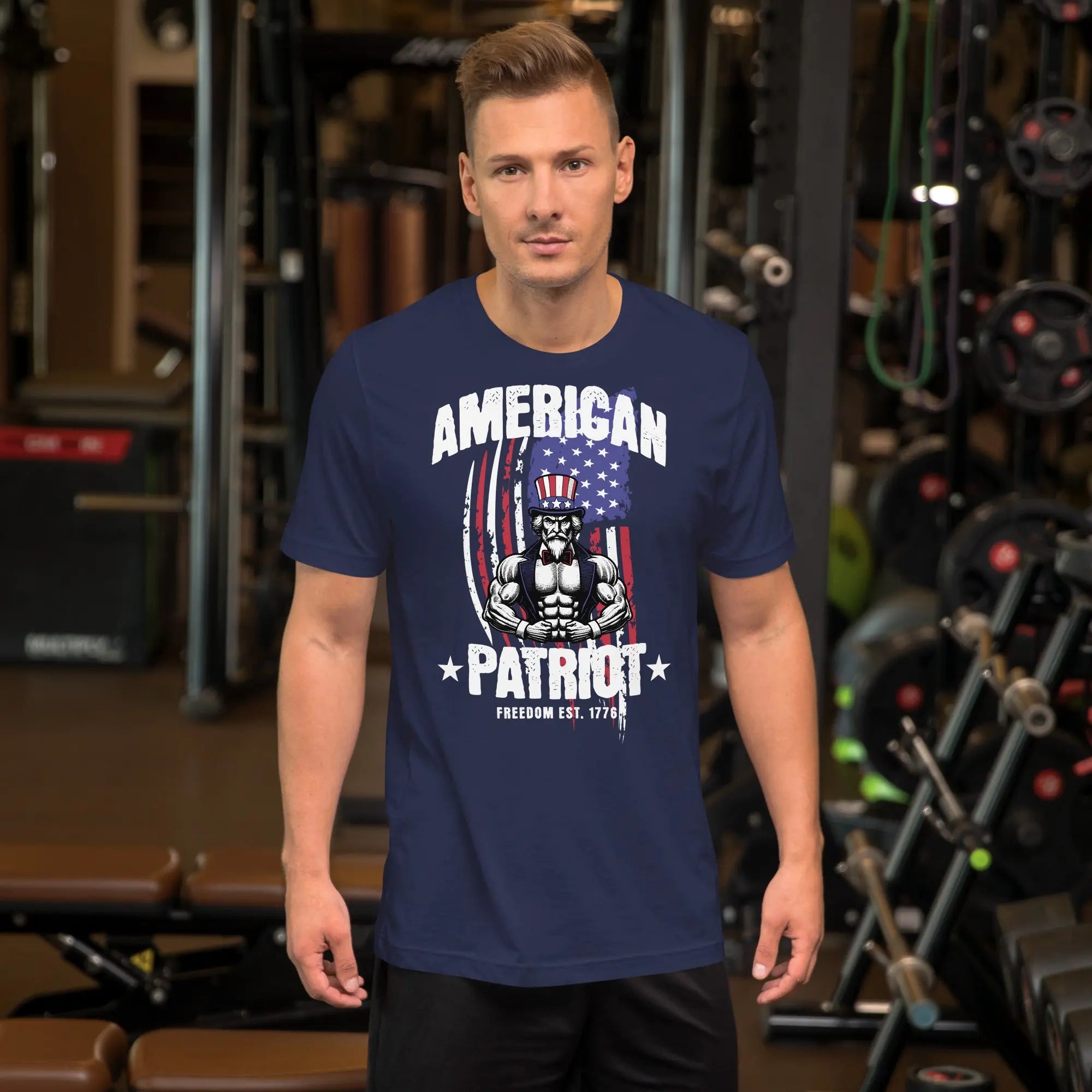 A man wearing a navy patriotic t-shirt with a muscular Uncle Sam with "American Patriot" text.