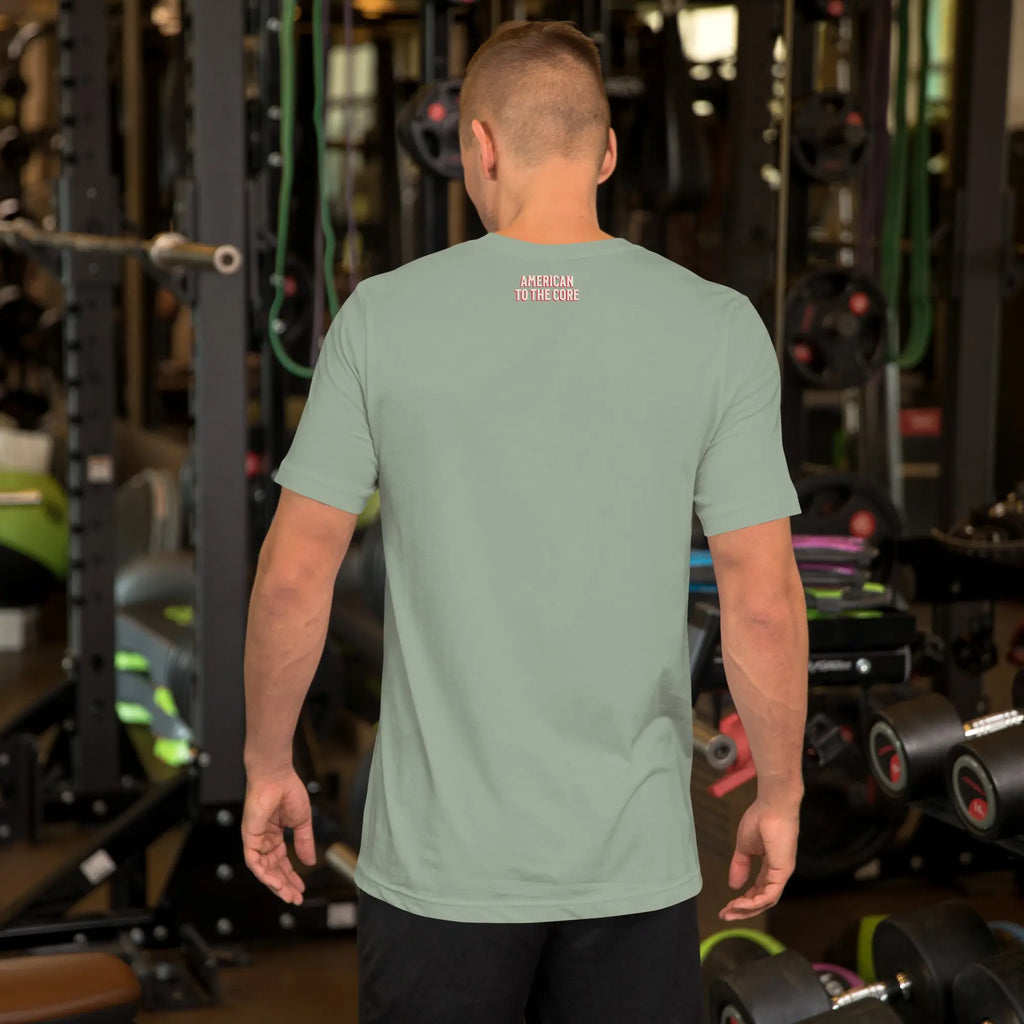 Man wearing a sage patriotic t-shirt with text in a gym setting