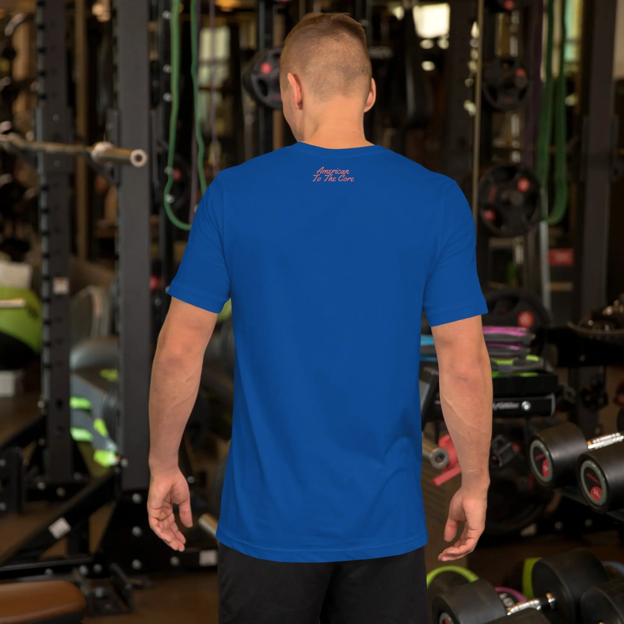Back of man wearing a royal blue patriotic t-shirt with "America to the core" text