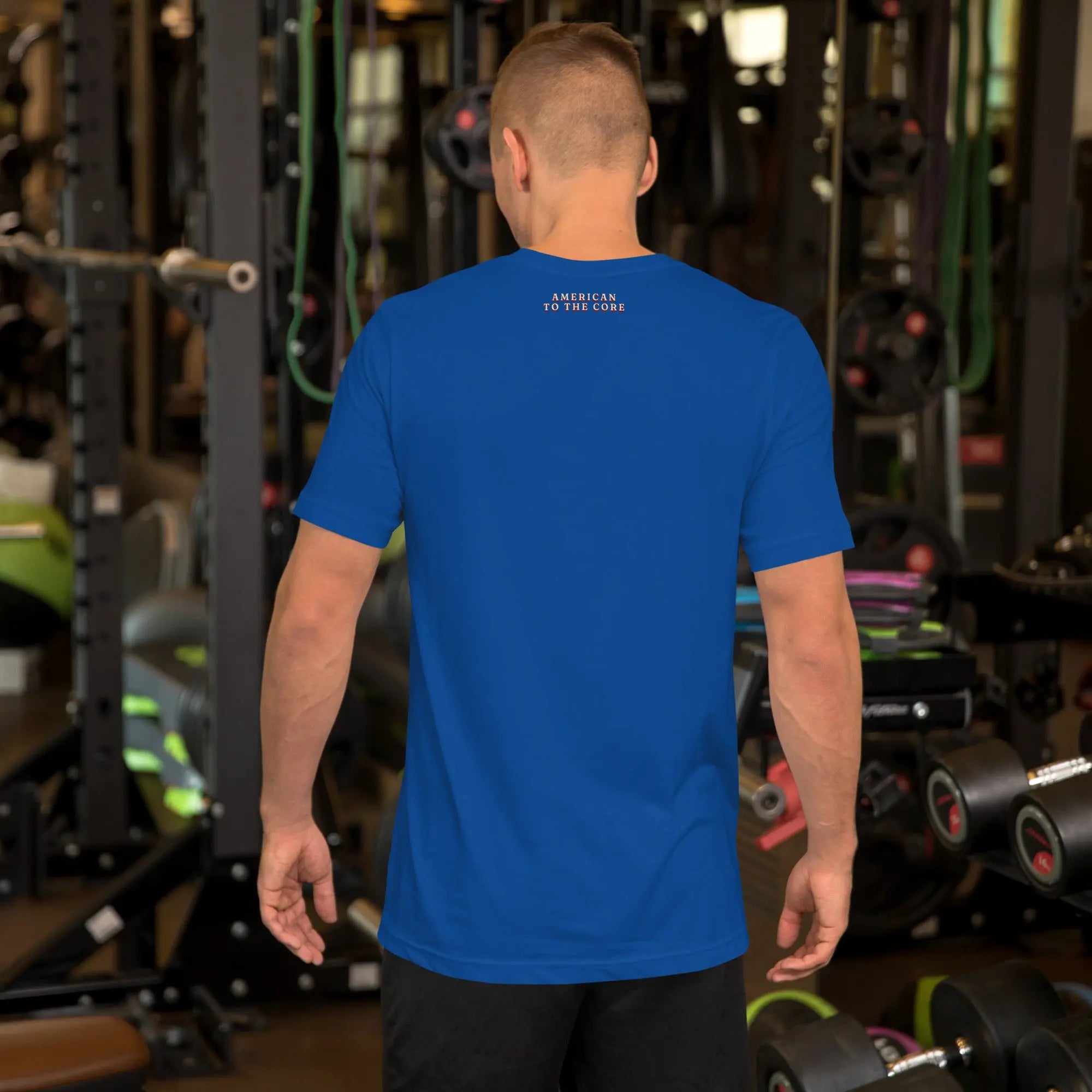 Back of man wearing a royal blue patriotic t-shirt with "America to the core" text