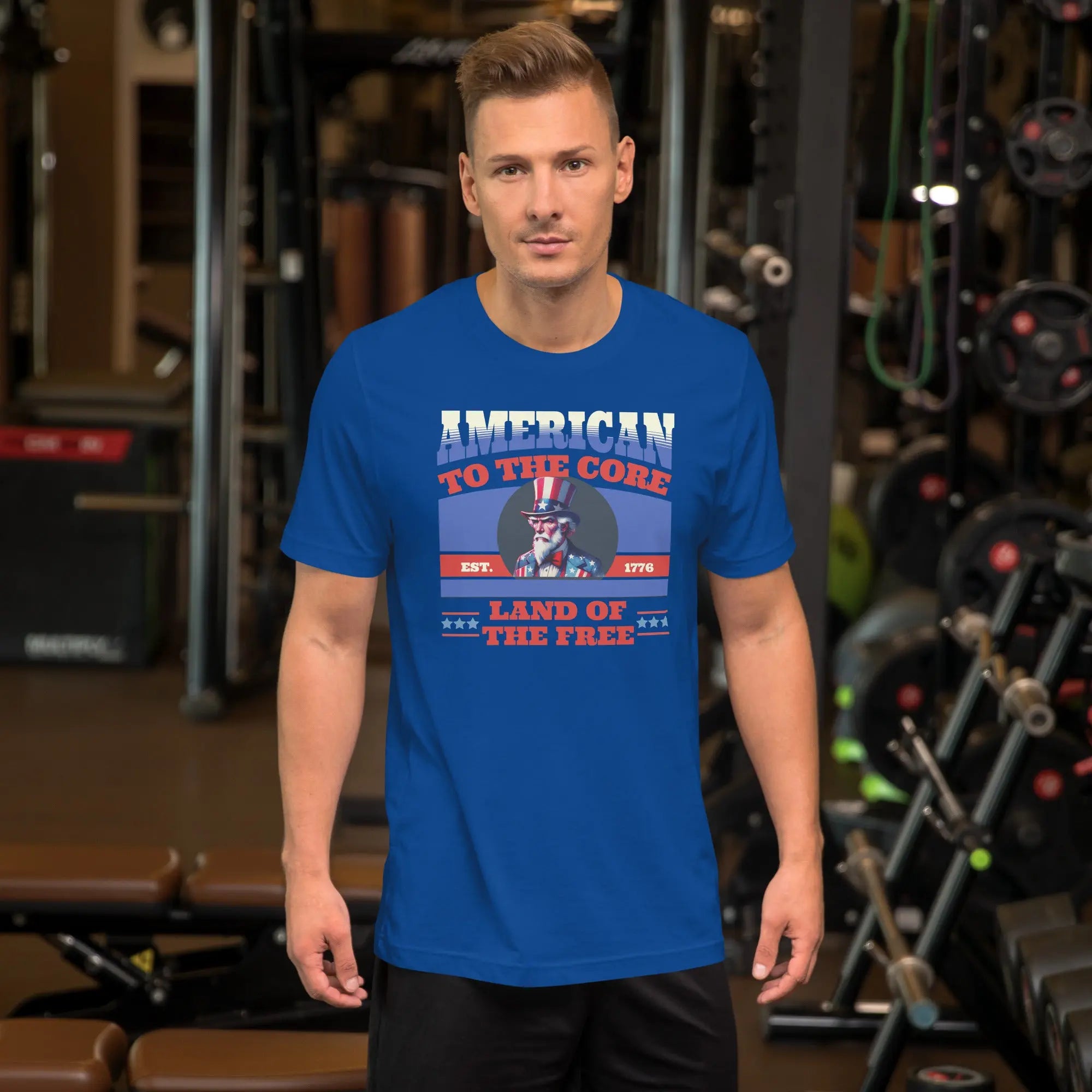 A man wearing a royal blue patriotic t-shirt with an image of Uncle Sam and "Land of the Free" text.