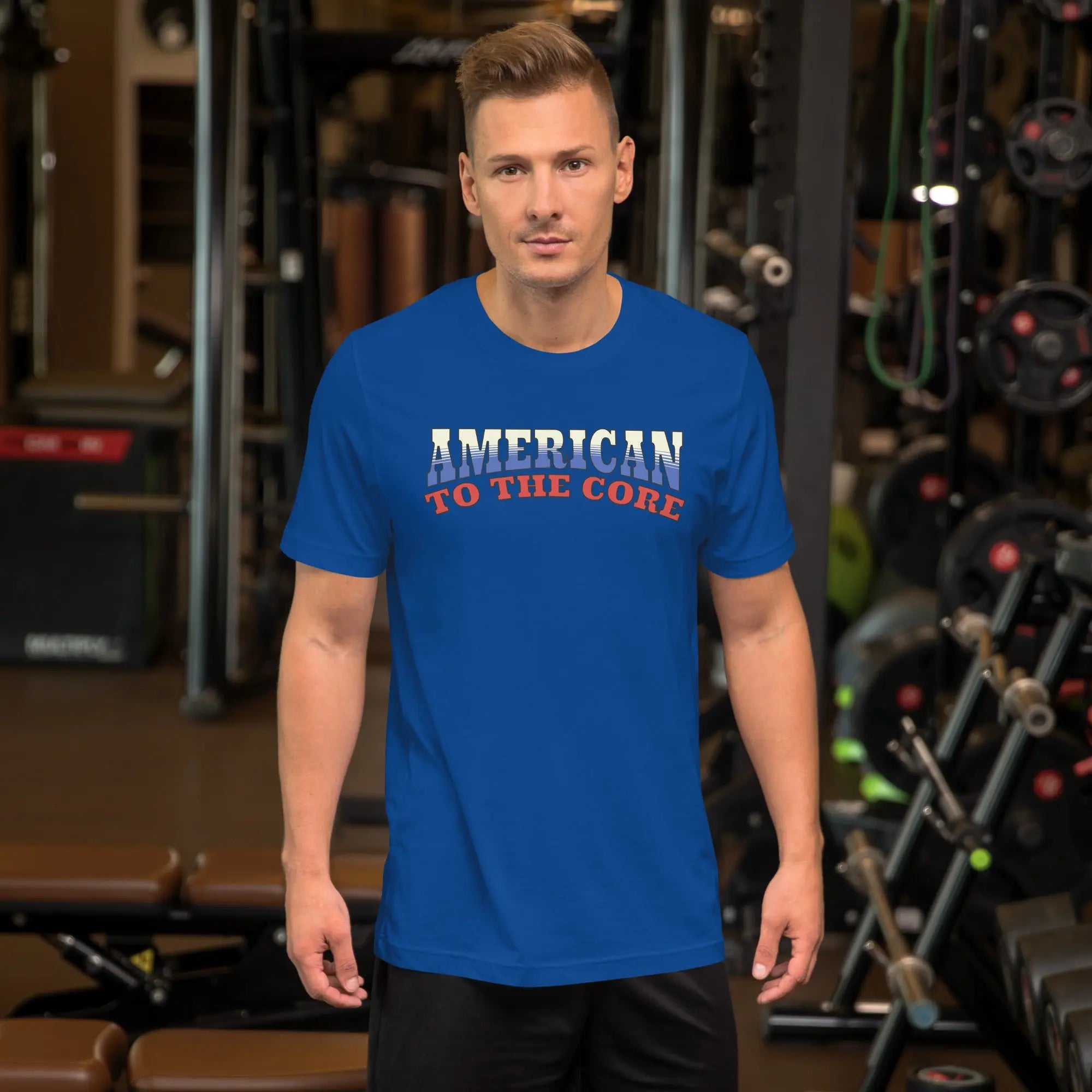 A man wearing a royal blue patriotic t-shirt with "America to the core" text in red, white and blue