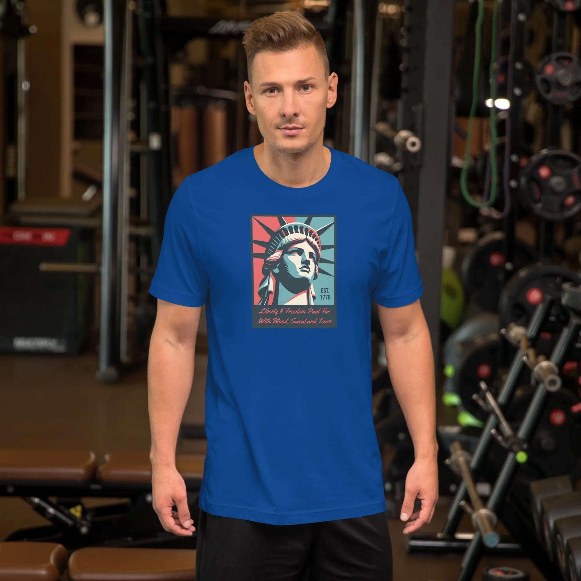 Front of man wearing a royal blue patriotic t-shirt with a picture of the statue of liberty 