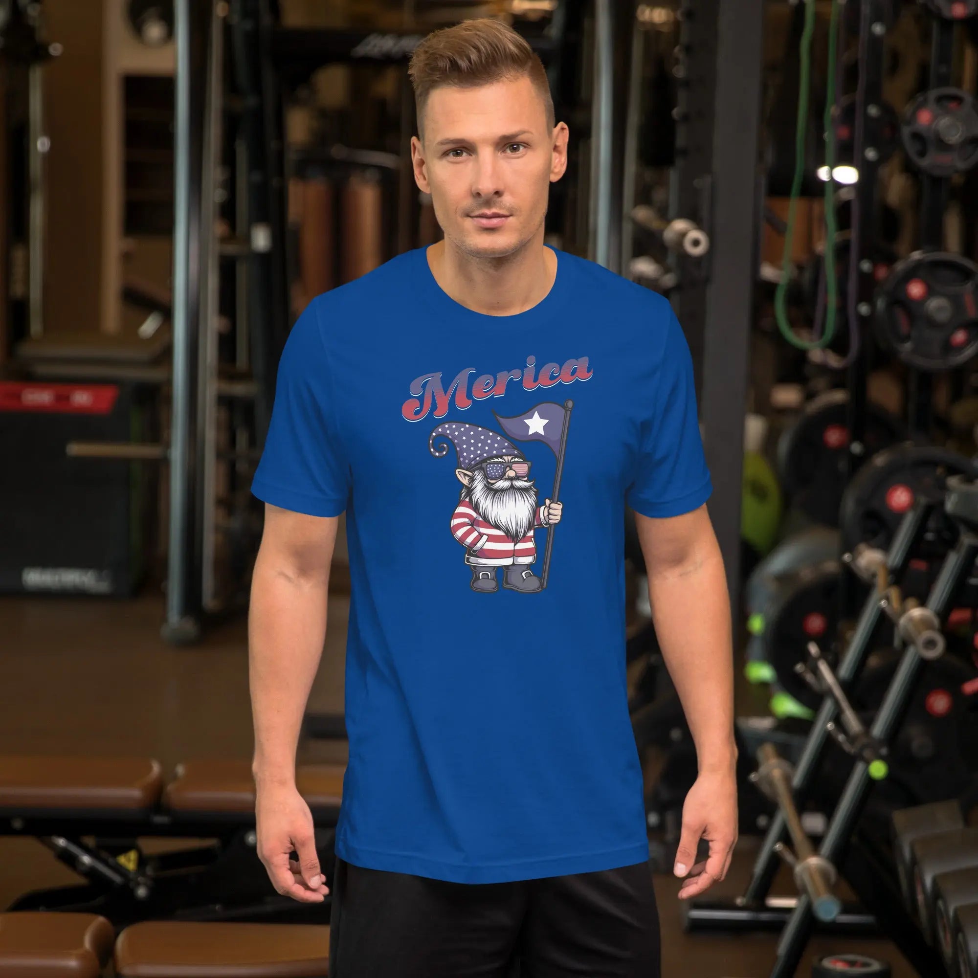 A man wearing a royal blue patriotic t-shirt with a gnome on it with "Merica" text.