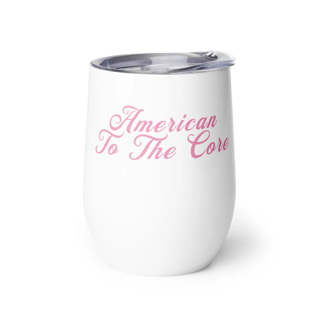 White tumbler with pink text 'American To The Core' on a white background