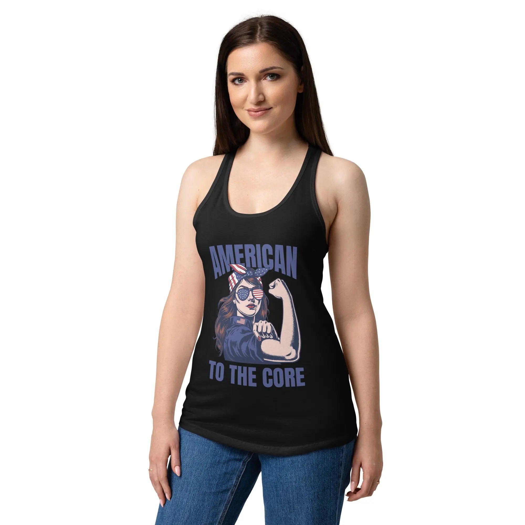A woman wearing a black, fitted, patriotic racerback tank top with a woman flexing and the text "American to the core."