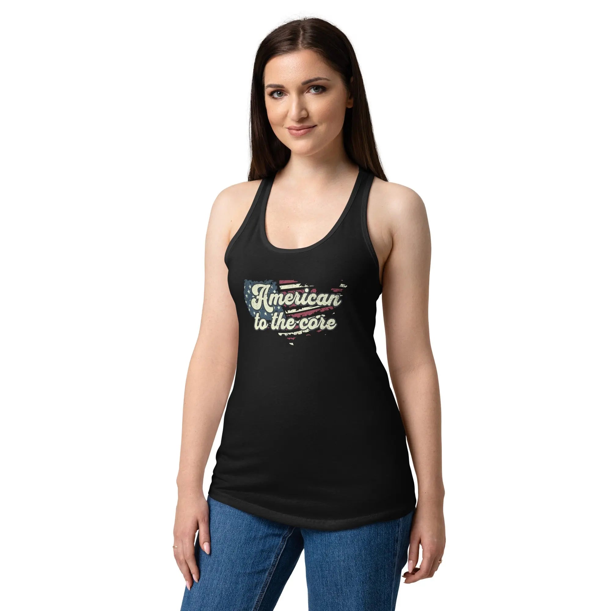A woman wearing a black, fitted, patriotic racerback tank top with an American flag shaped like the country and the text "American to the core."