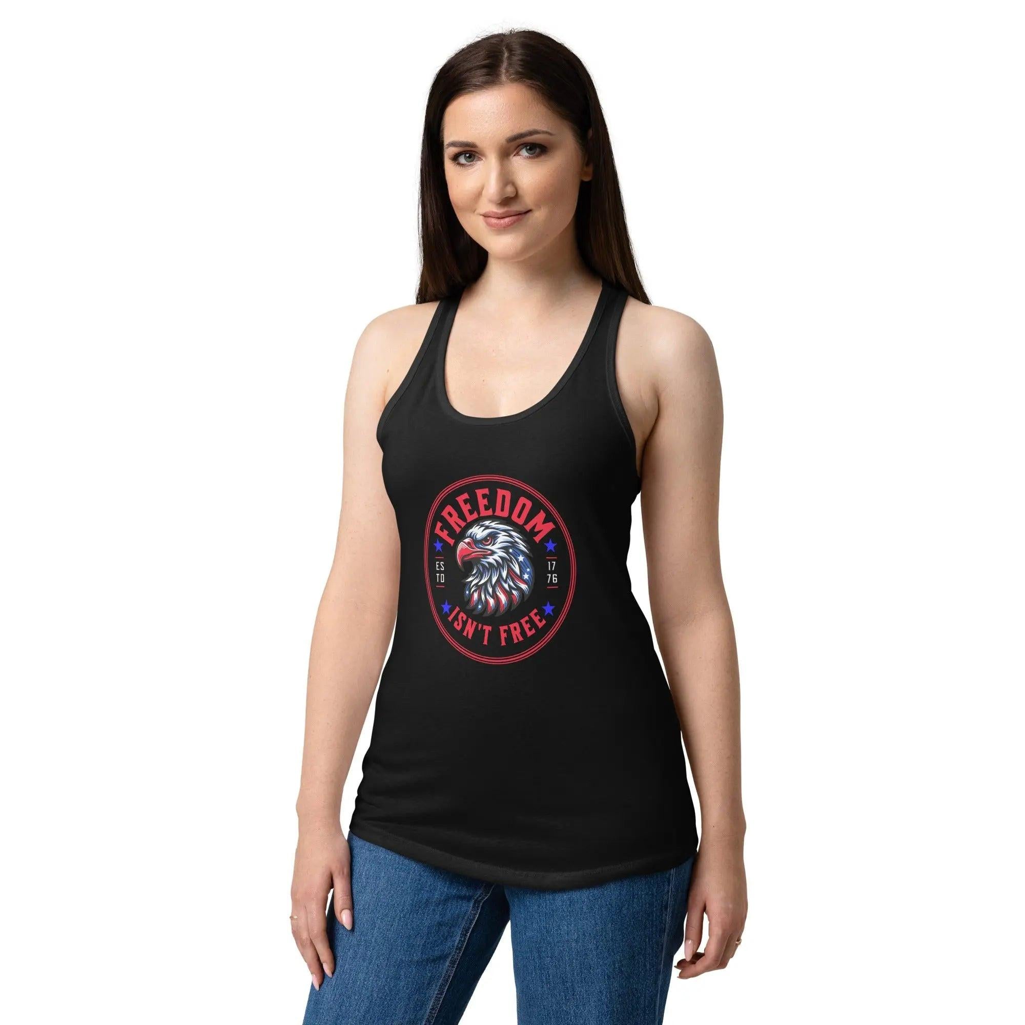 A woman wearing a black patriotic tank top with an eagle head and the text "Freedom isn't free." 