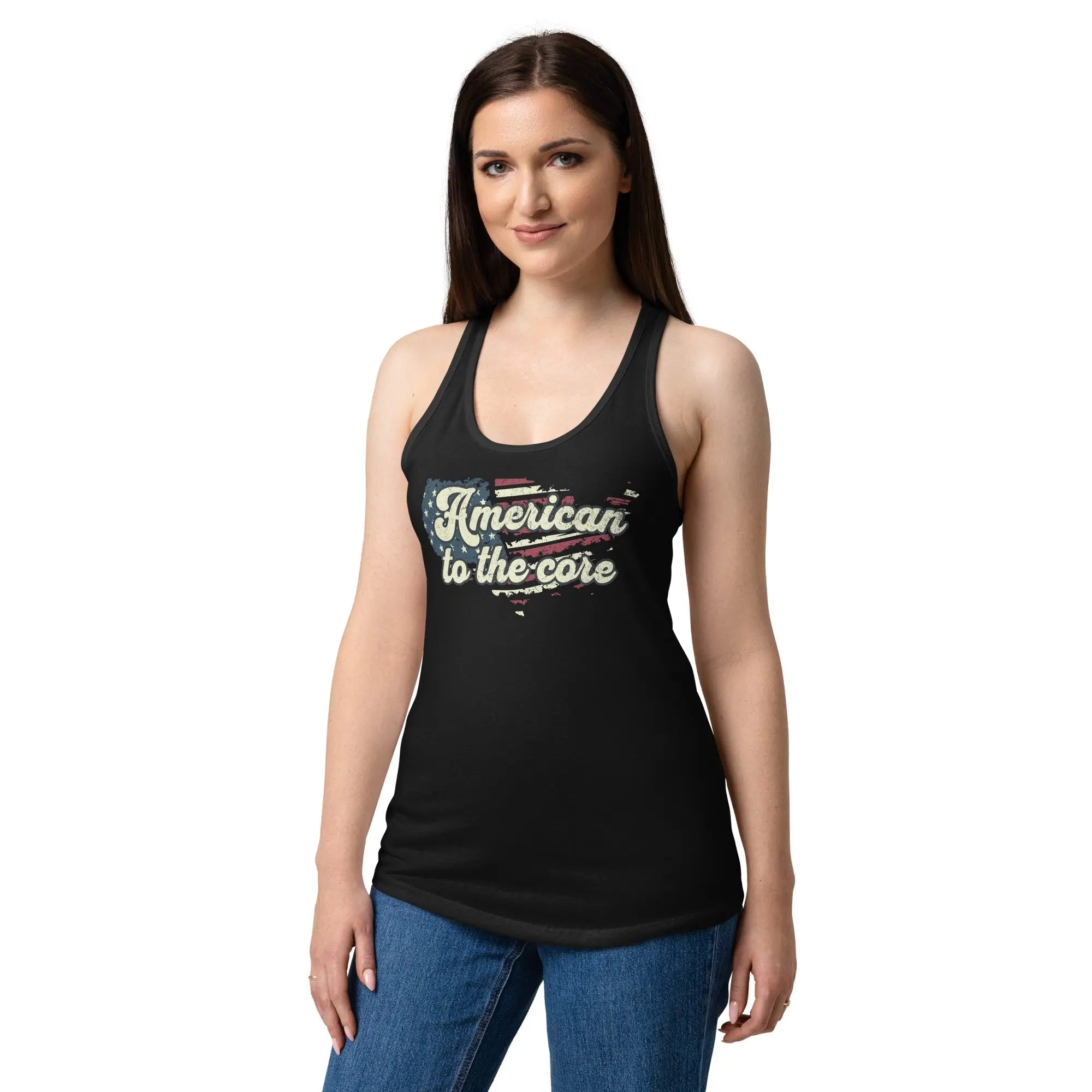 A woman wearing a black, fitted, patriotic racerback tank top with an American flag shaped like the country and the text "American to the core."