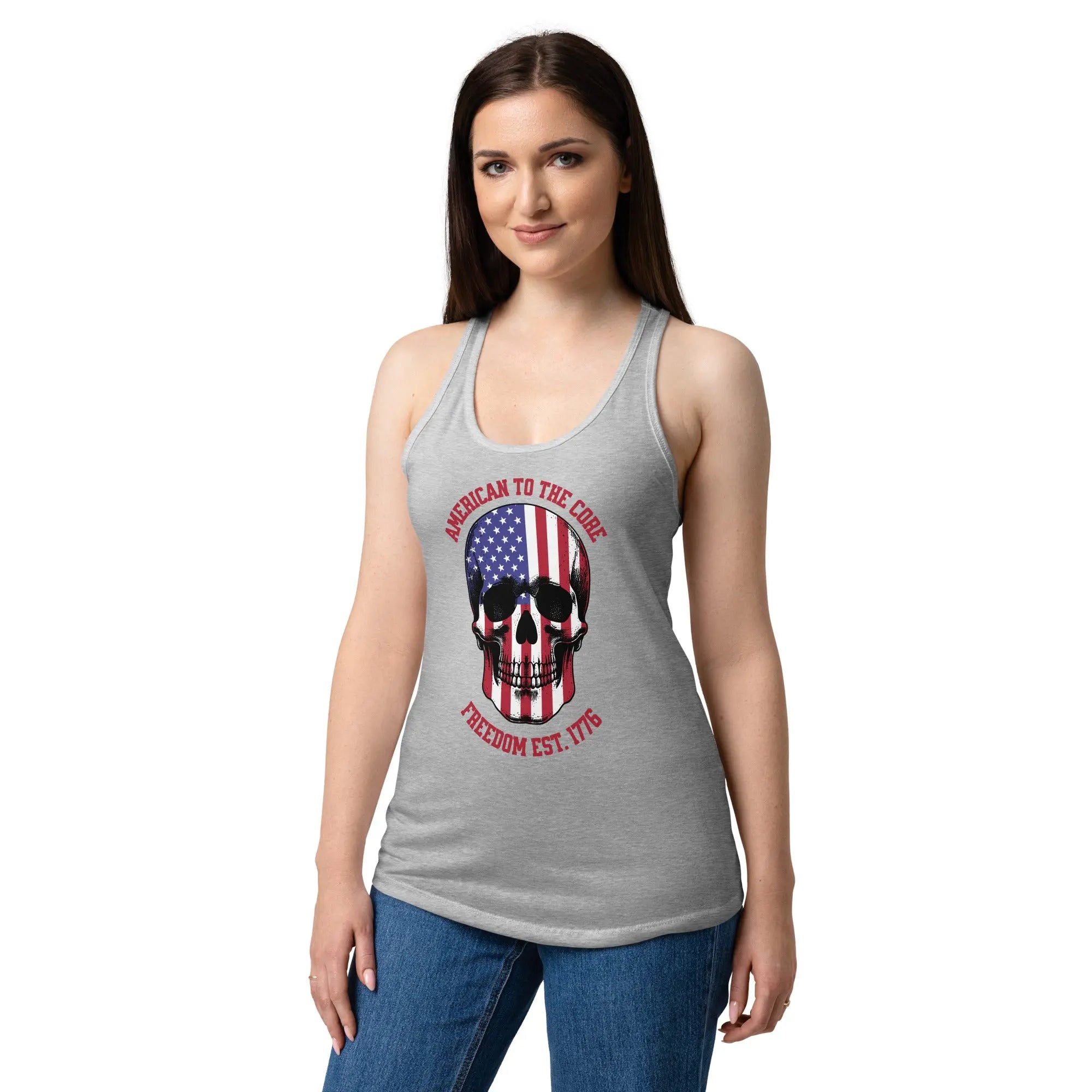 A woman wearing a heather grey patriotic tank top with a skull and the text "Freedom est. 1776."