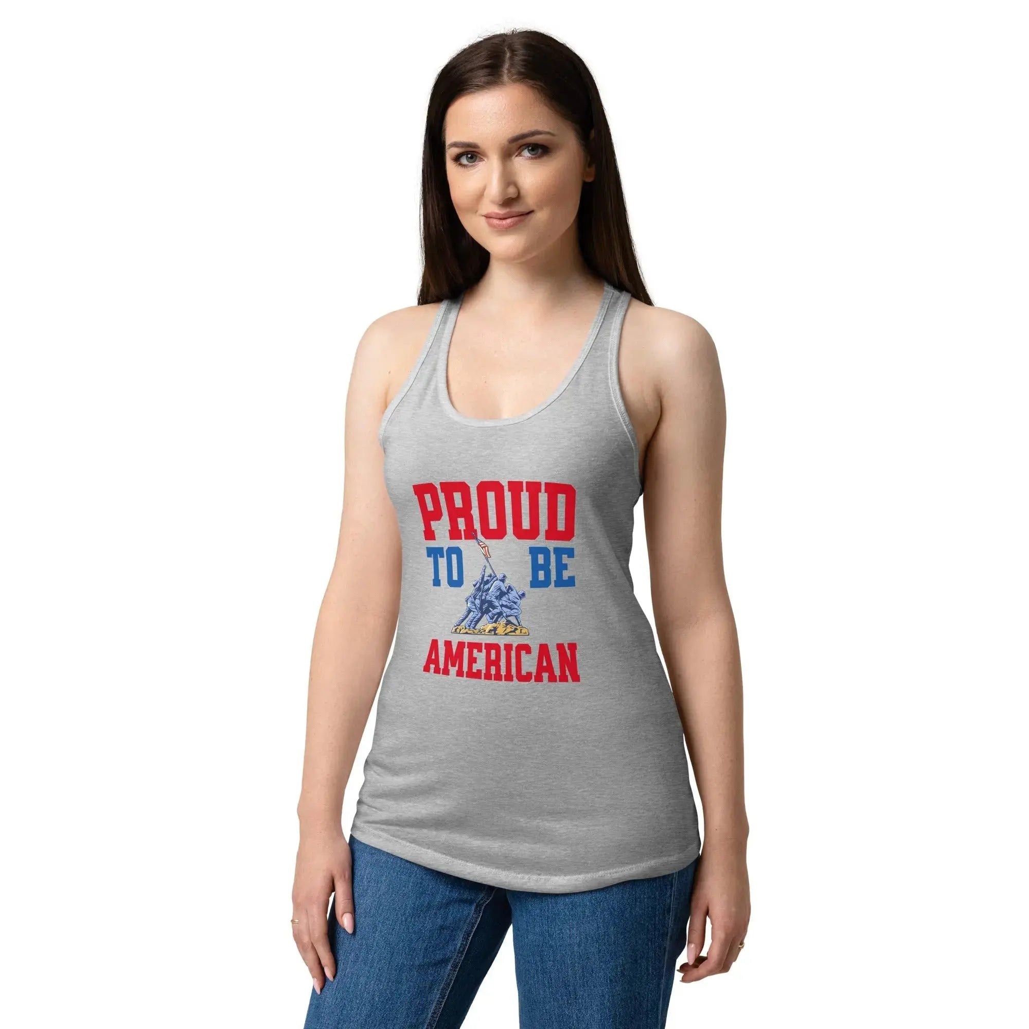 A woman wearing a heather grey patriotic tank top with soldiers raising the flag and the text "Proud to be American."