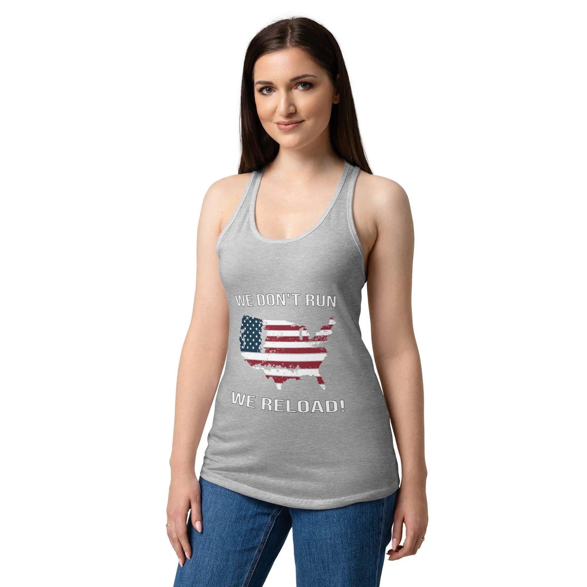 A woman wearing a heather grey patriotic tank top with the American flag in the shape of America and the text "We Don't Run, We Reload!"