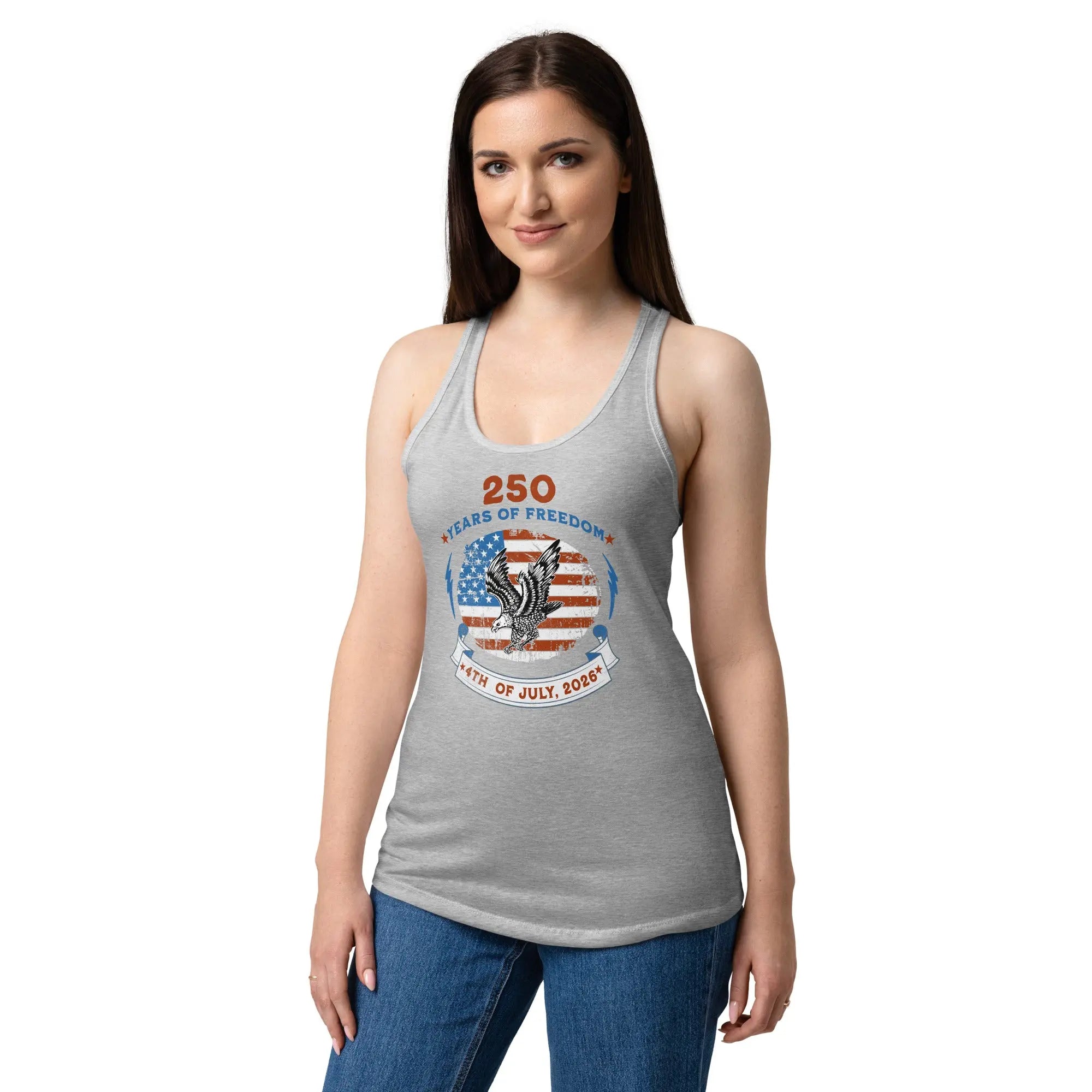 A woman wearing a heather gray patriotic tank top with the American flag with a flying eagle and the text "250 years of freedom 4th of July, 2026."