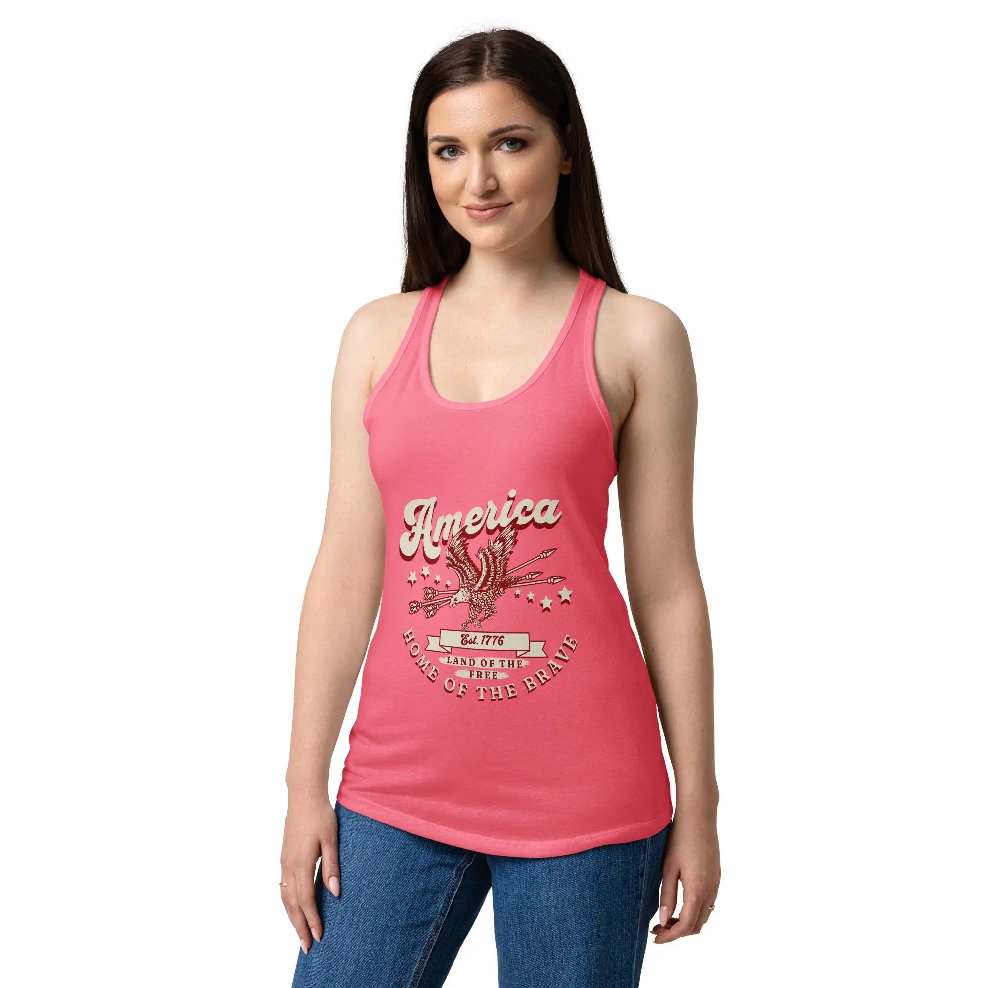 A woman wearing a hot pink patriotic tank top with a flying eagle and the text "America Home of the brave." 