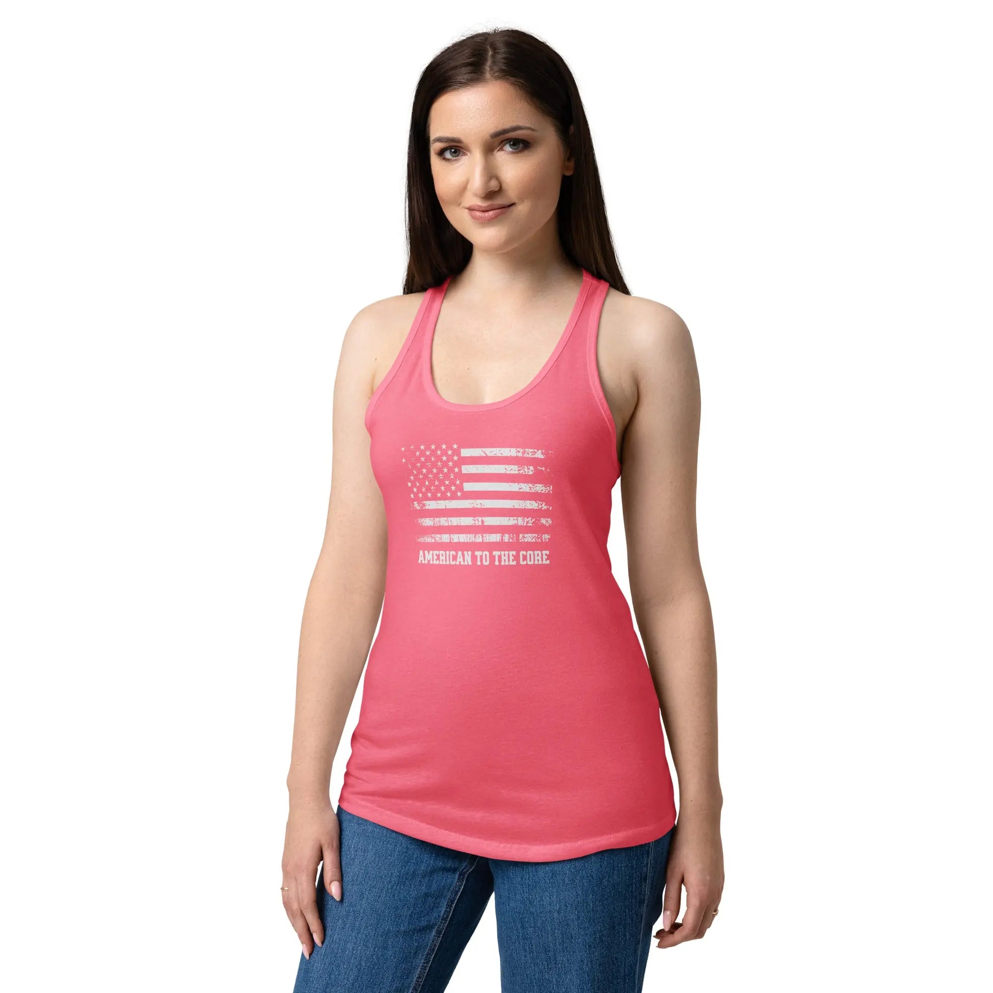 A woman wearing a hot pink patriotic tank top with the American flag and the text "American to the core."
