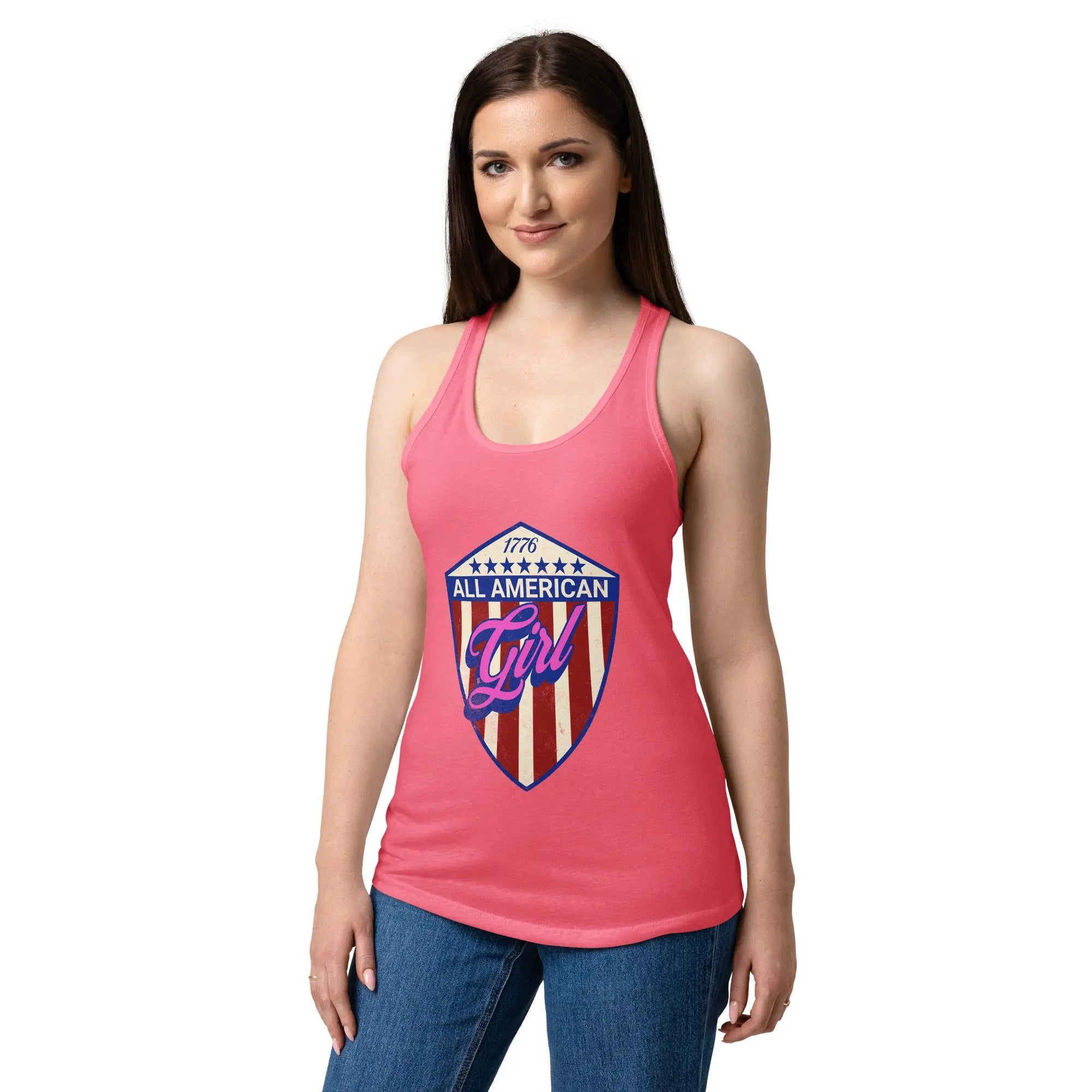 A woman wearing a hot pink patriotic tank top with an eagle head and the text "Freedom isn't free" 