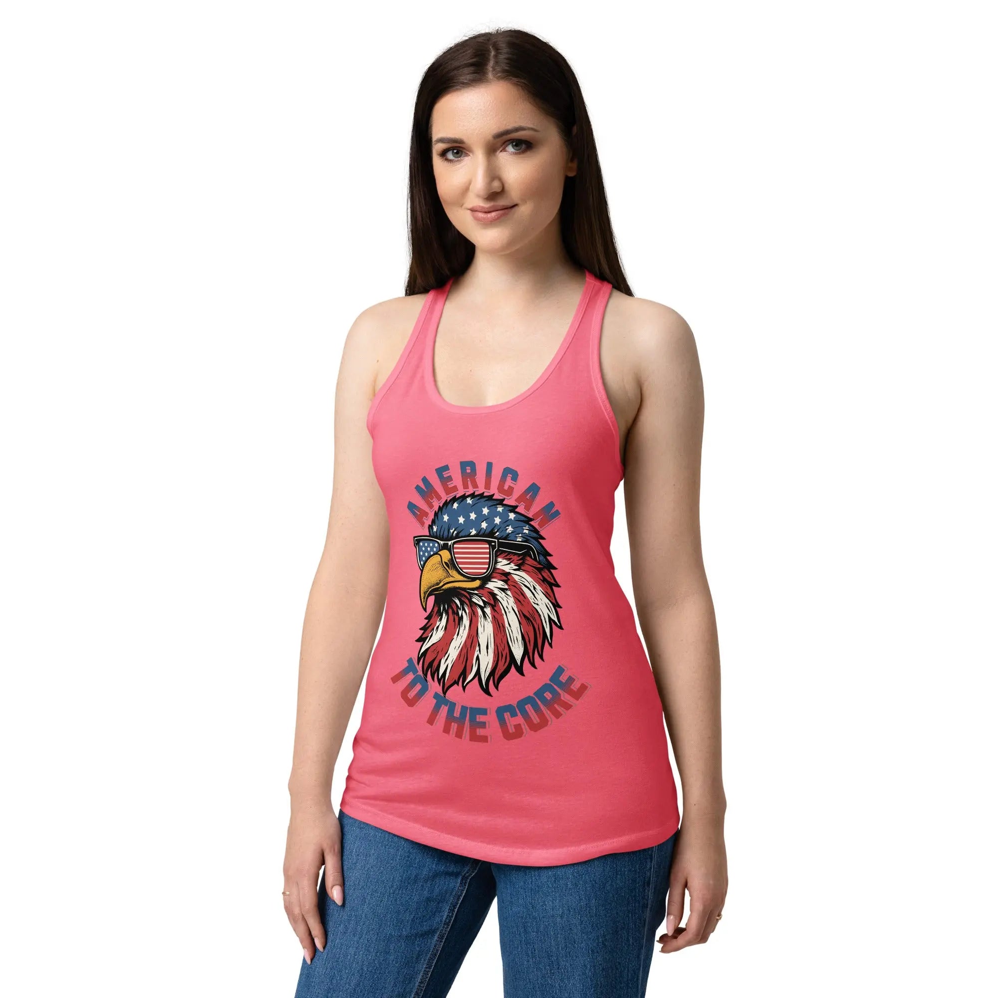 A woman wearing a hot pink patriotic tank top with a eagle head and the text "American to the core"