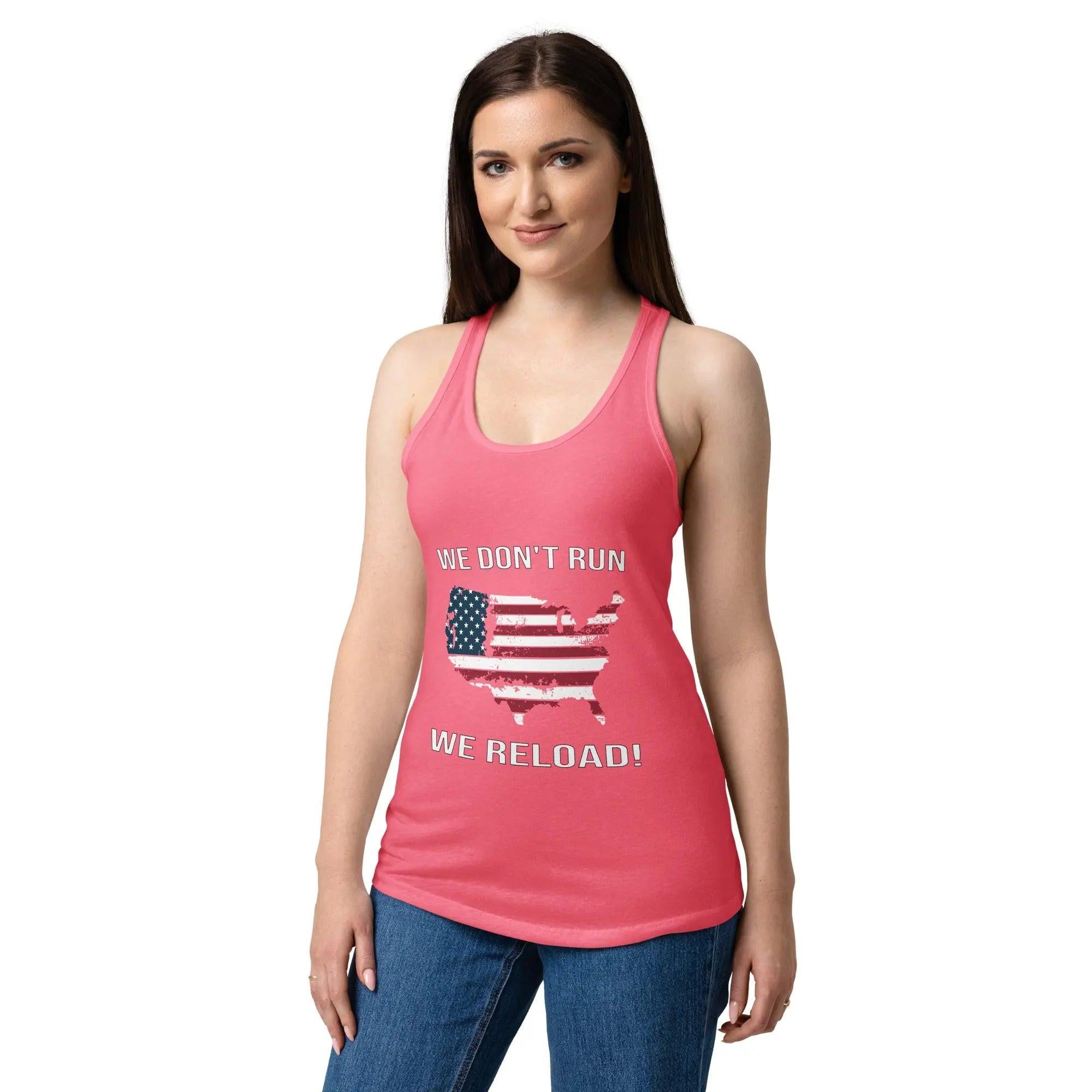 A woman wearing a hot pink patriotic tank top with the American flag in the shape of America and the text "We Don't Run, We Reload!"