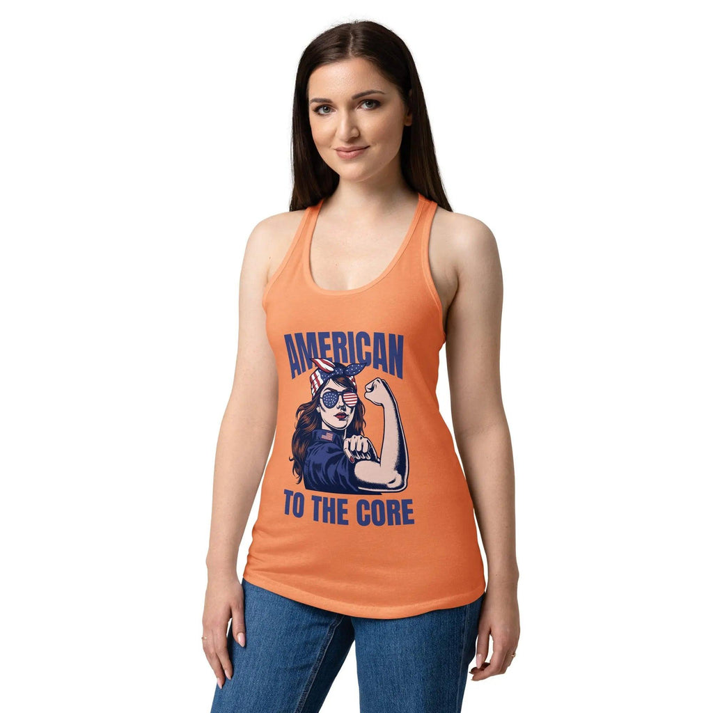 A woman wearing a light orange, fitted, patriotic racerback tank top with a woman flexing and the text "American to the core."