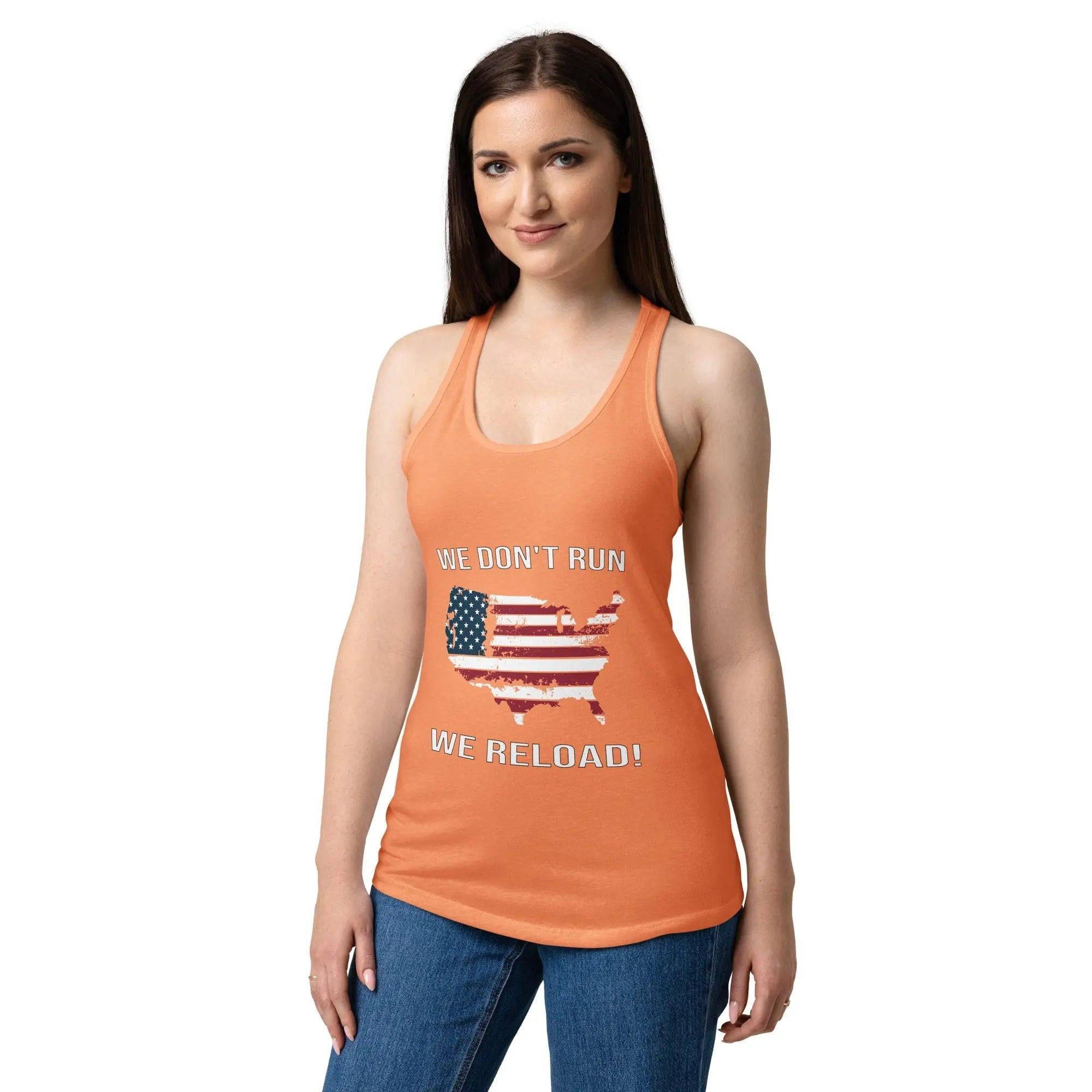 A woman wearing a light orange patriotic tank top with the American flag in the shape of America and the text "We Don't Run, We Reload!"