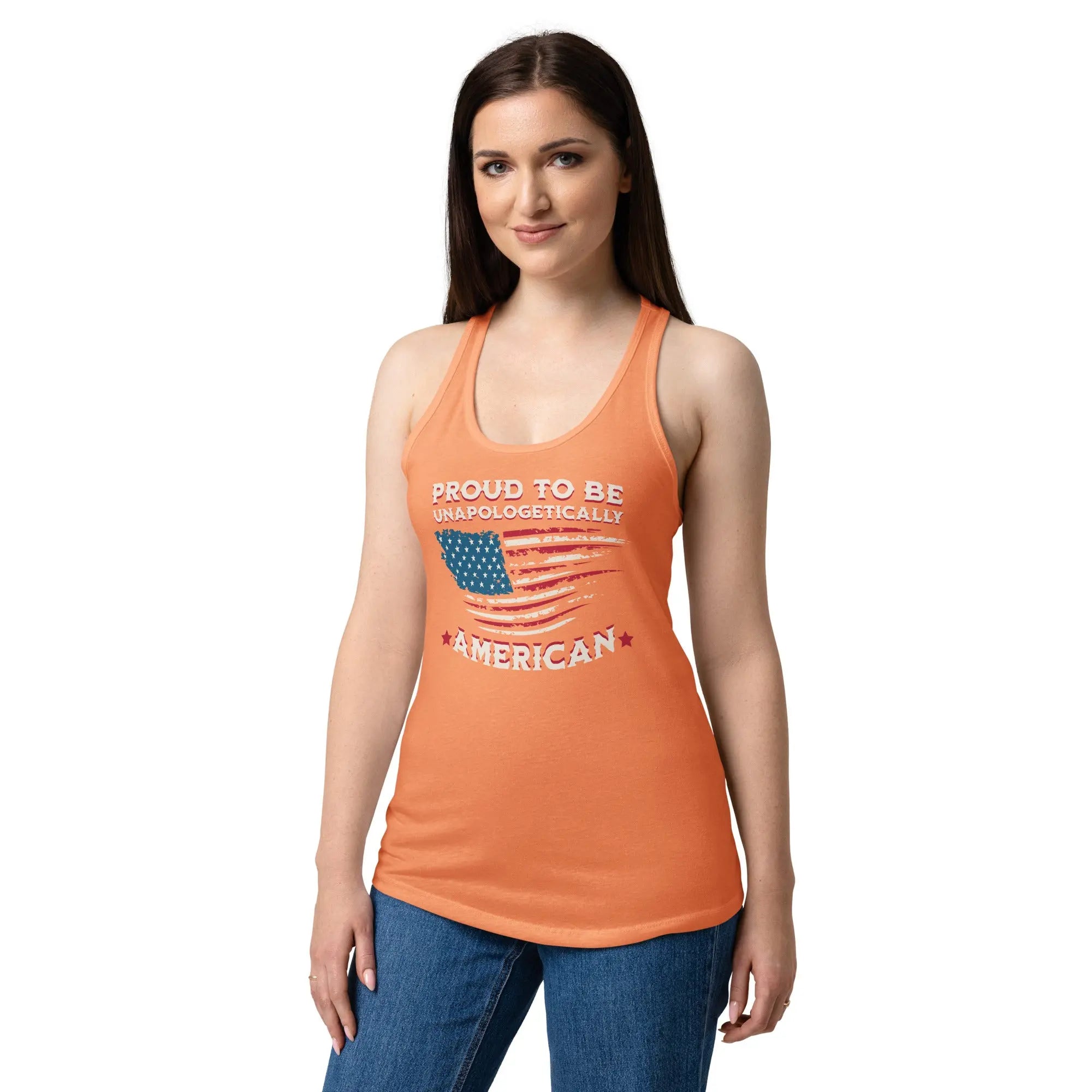 A woman wearing a light orange patriotic tank top with the American flag and the text "Proud to be unapologetically American" 