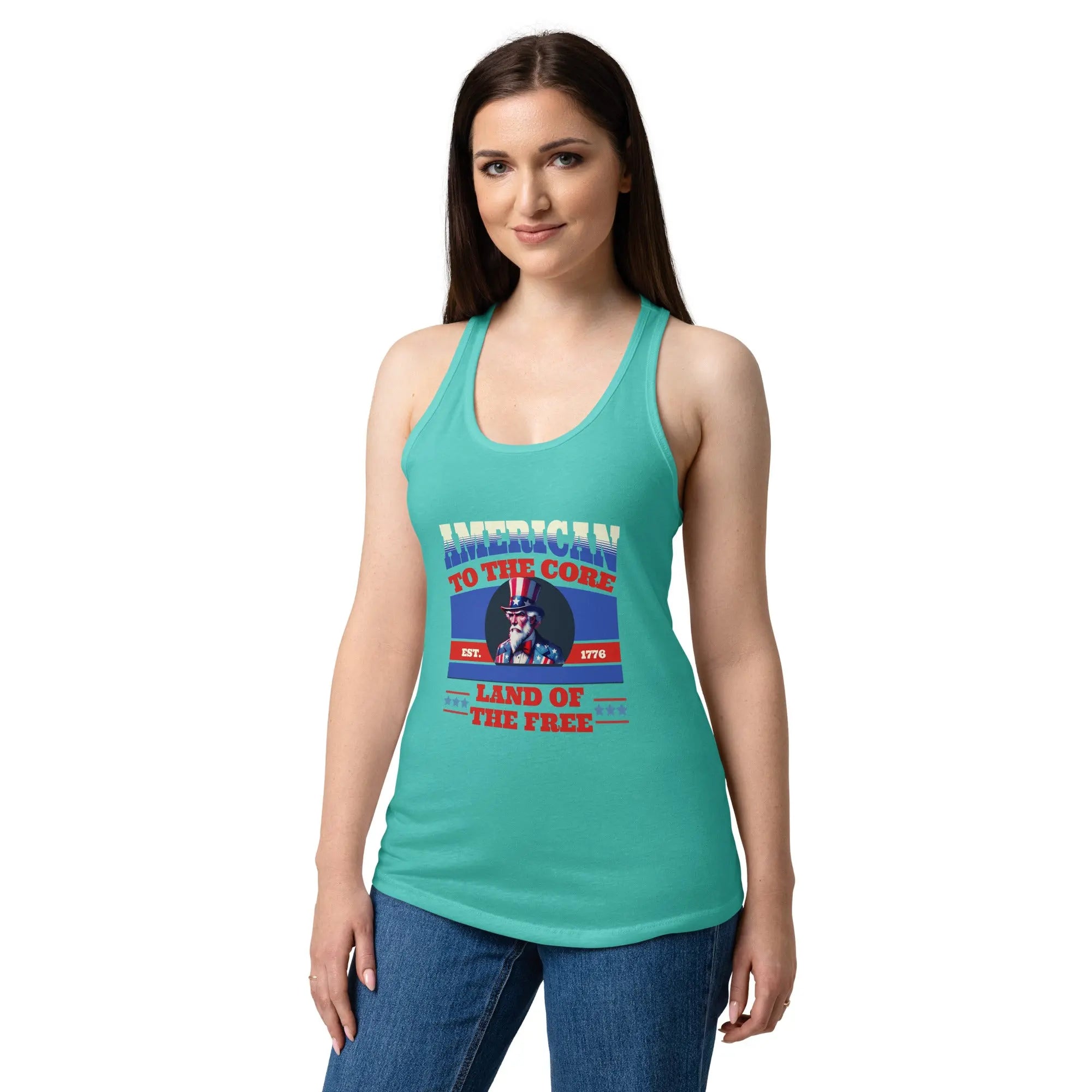 A woman wearing a tahiti blue patriotic tank top with Uncle Sam and the text "American To The Core" in red, white, and blue. 
