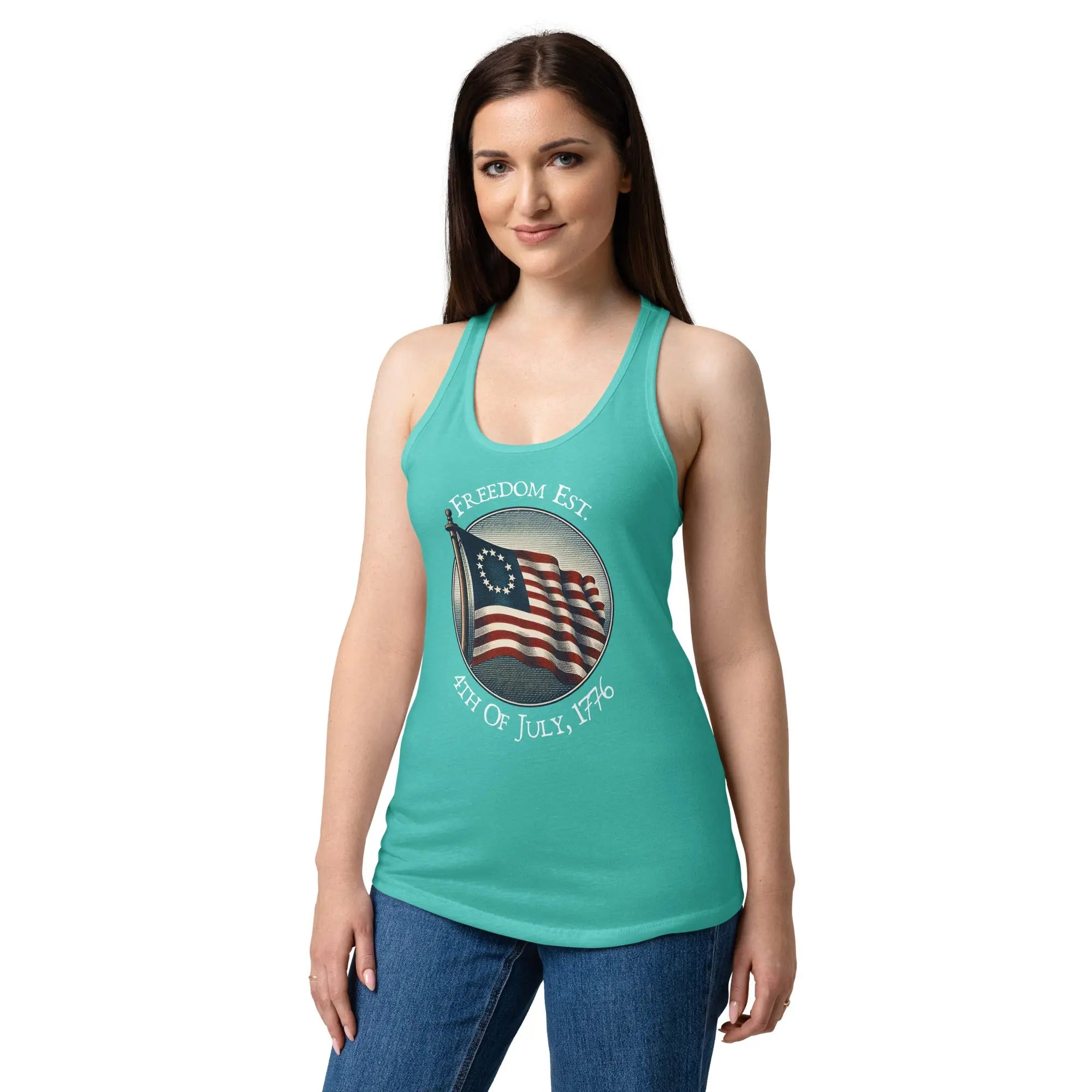A woman wearing a tahiti blue patriotic racerback tank top with the American flag and the text "Freedom Est. 4th of July, 1776."