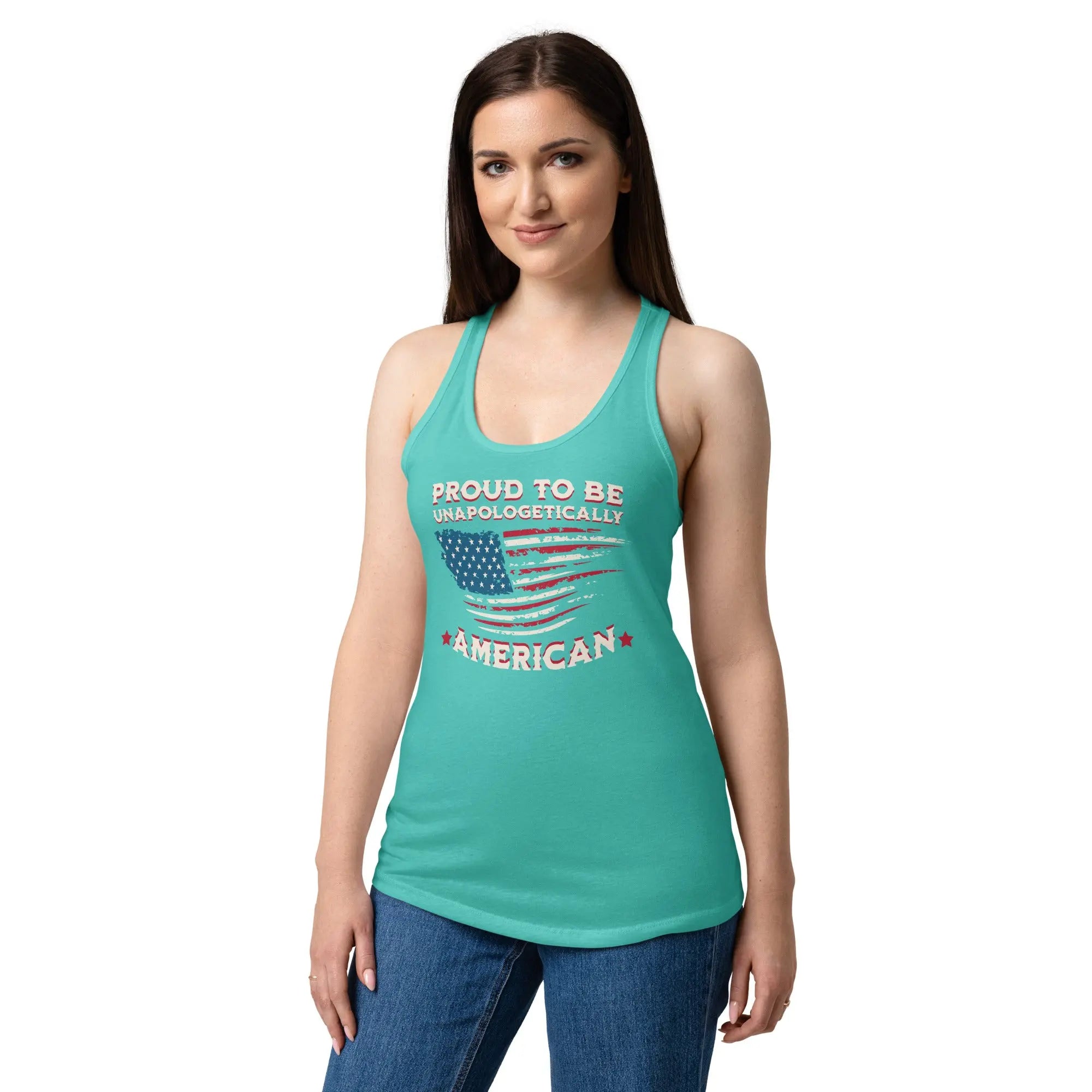 A woman wearing a tahiti blue patriotic tank top with the American flag and the text "Proud to be unapologetically American" 