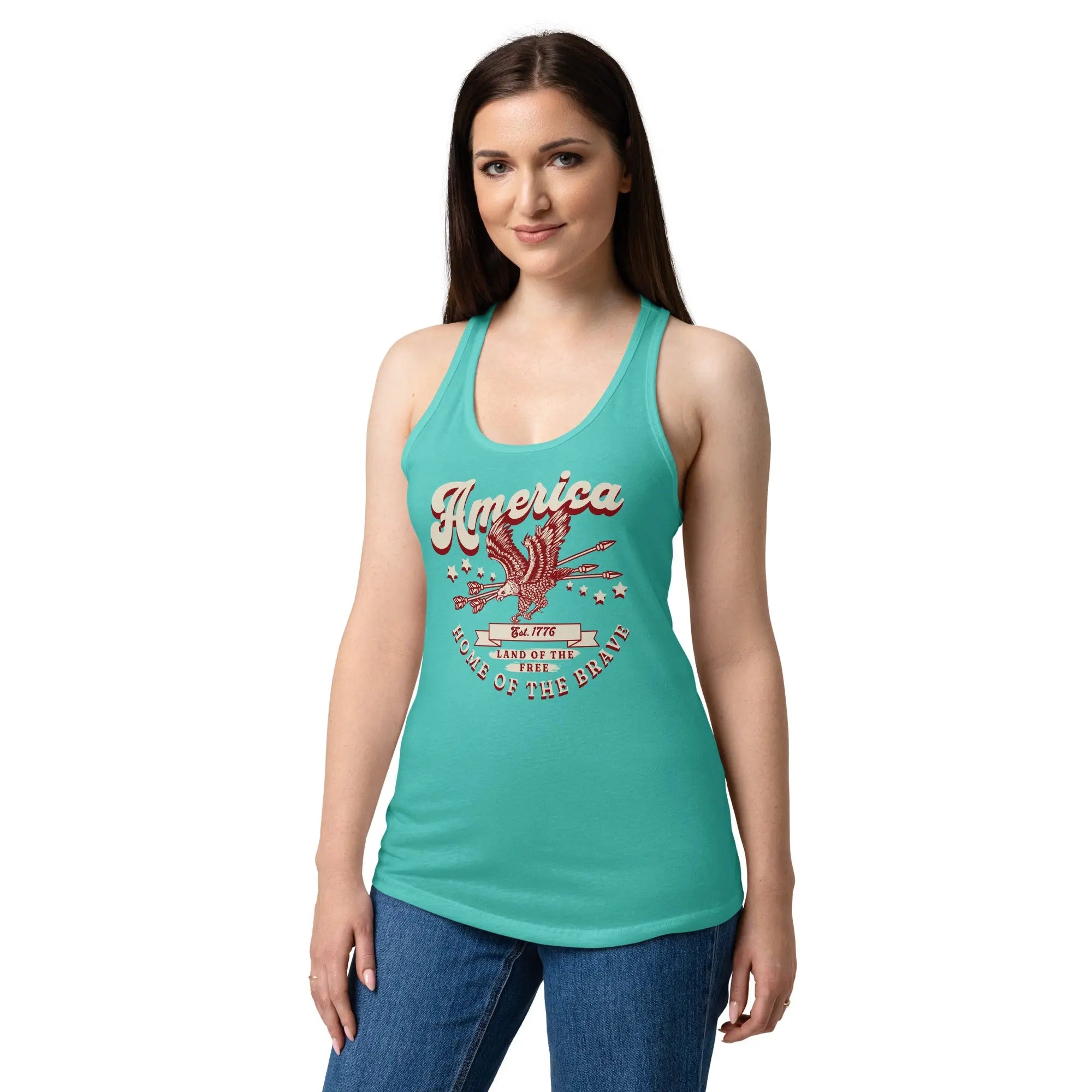A woman wearing a tahiti blue patriotic tank top with a flying eagle and the text "America Home of the brave." 