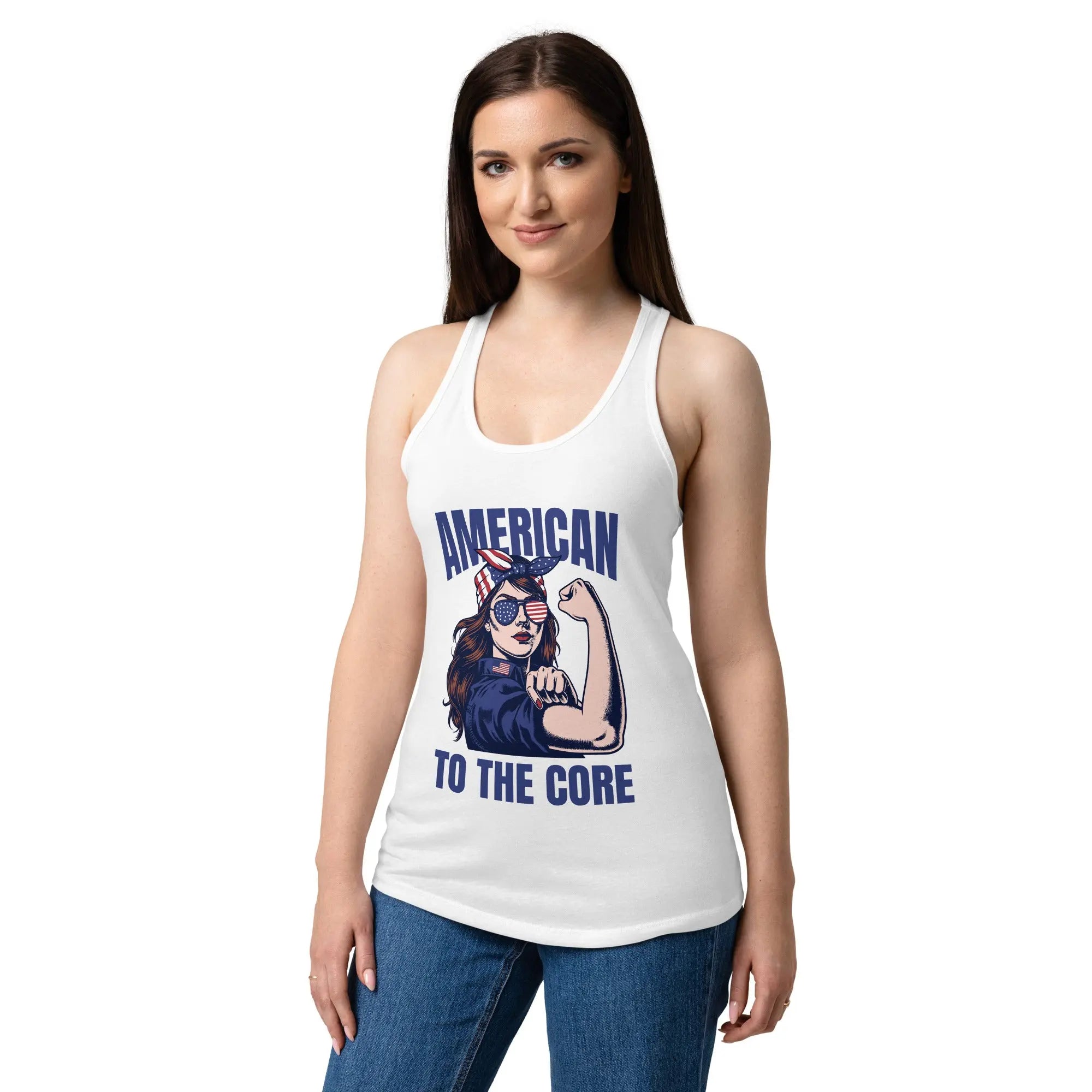A woman wearing a white, fitted, patriotic racerback tank top with a woman flexing and the text "American to the core."