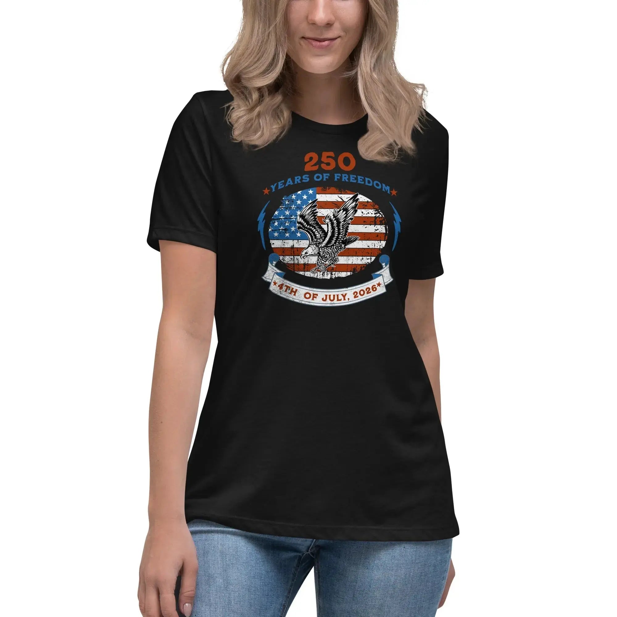 A woman wearing a black patriotic t-shirt with the American flag with a flying eagle over it and the text "250 years of freedom 4th of July, 2026."