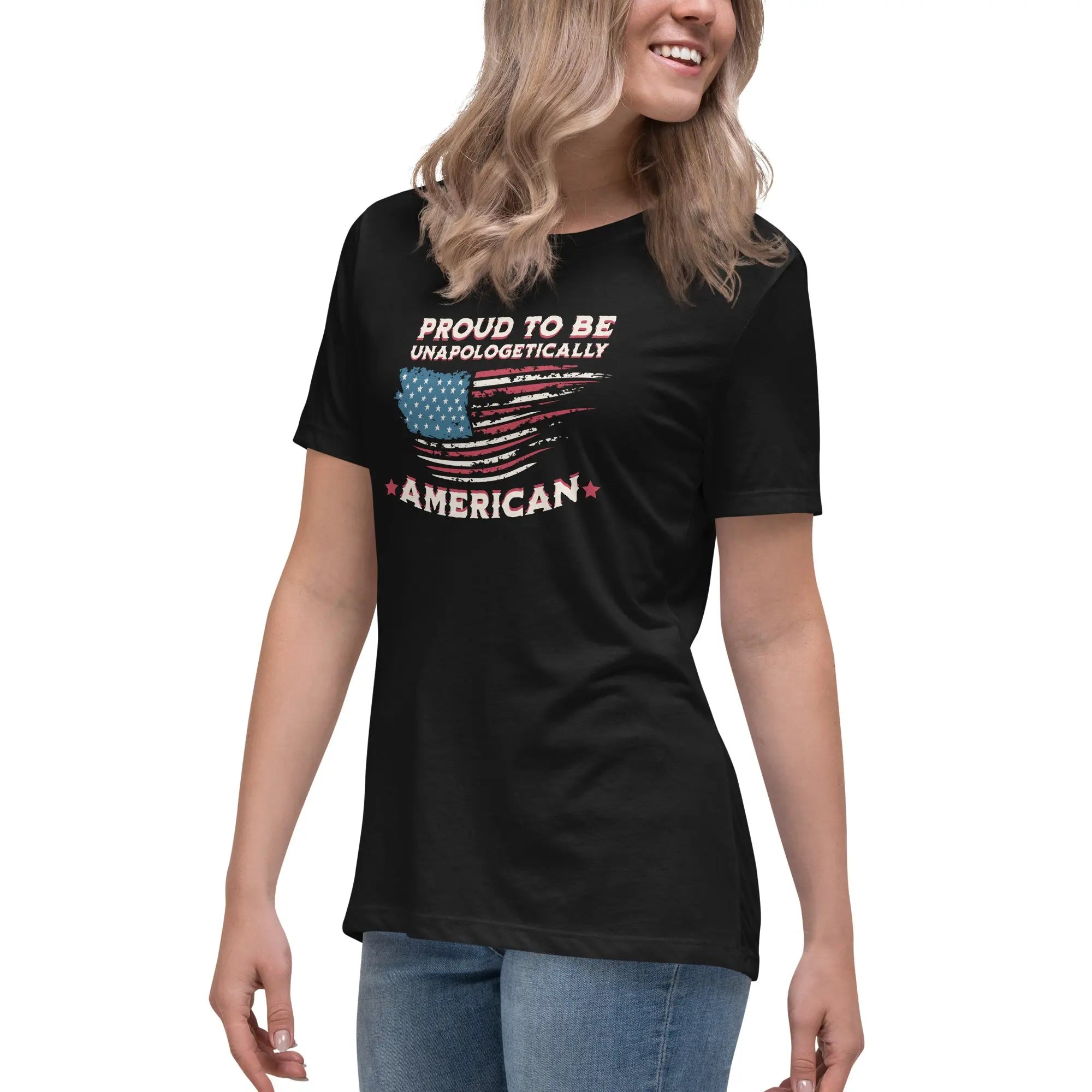 A woman wearing a black patriotic t-shirt with the American flag and "Proud To Be Unapologetically American" text.