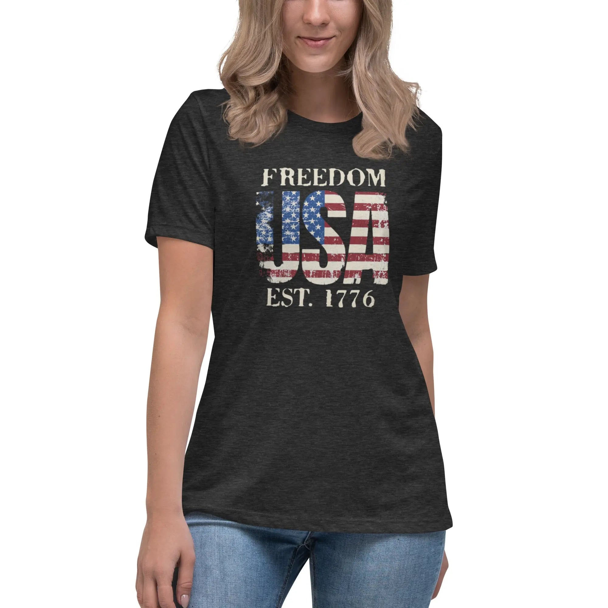 Back of woman wearing a dark grey patriotic t-shirt with  "Freedom USA Est. 1776" text