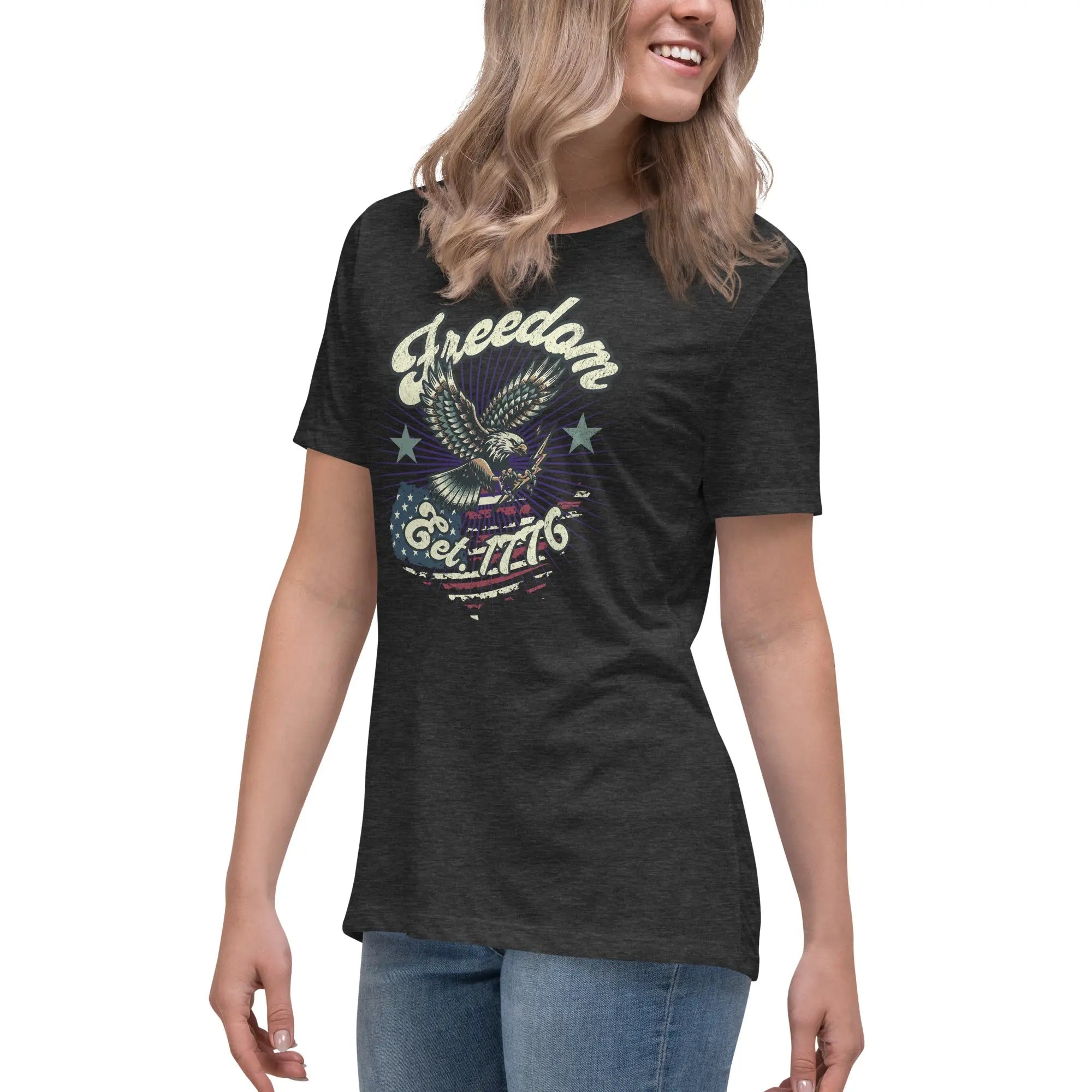 A woman wearing a dark grey patriotic t-shirt with an eagle and "Freedom Est. 1776" text.