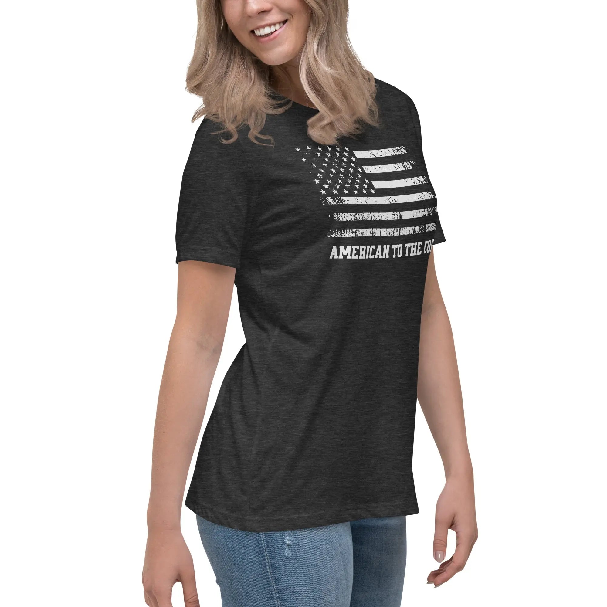 A woman wearing a patriotic dark grey t-shirt with the American flag in black and white and "American to the core" text