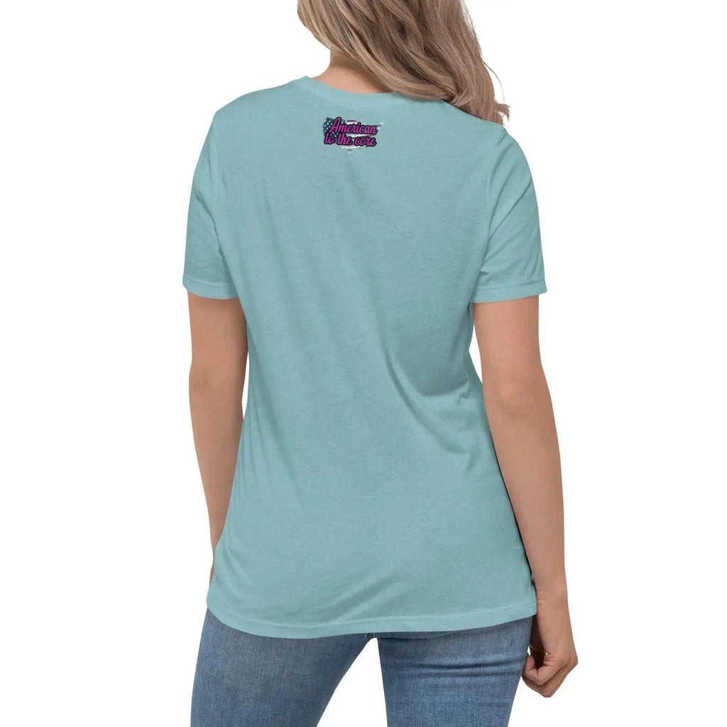 Back of a woman wearing a heather blue patriotic t-shirt with the text "American To The Core."