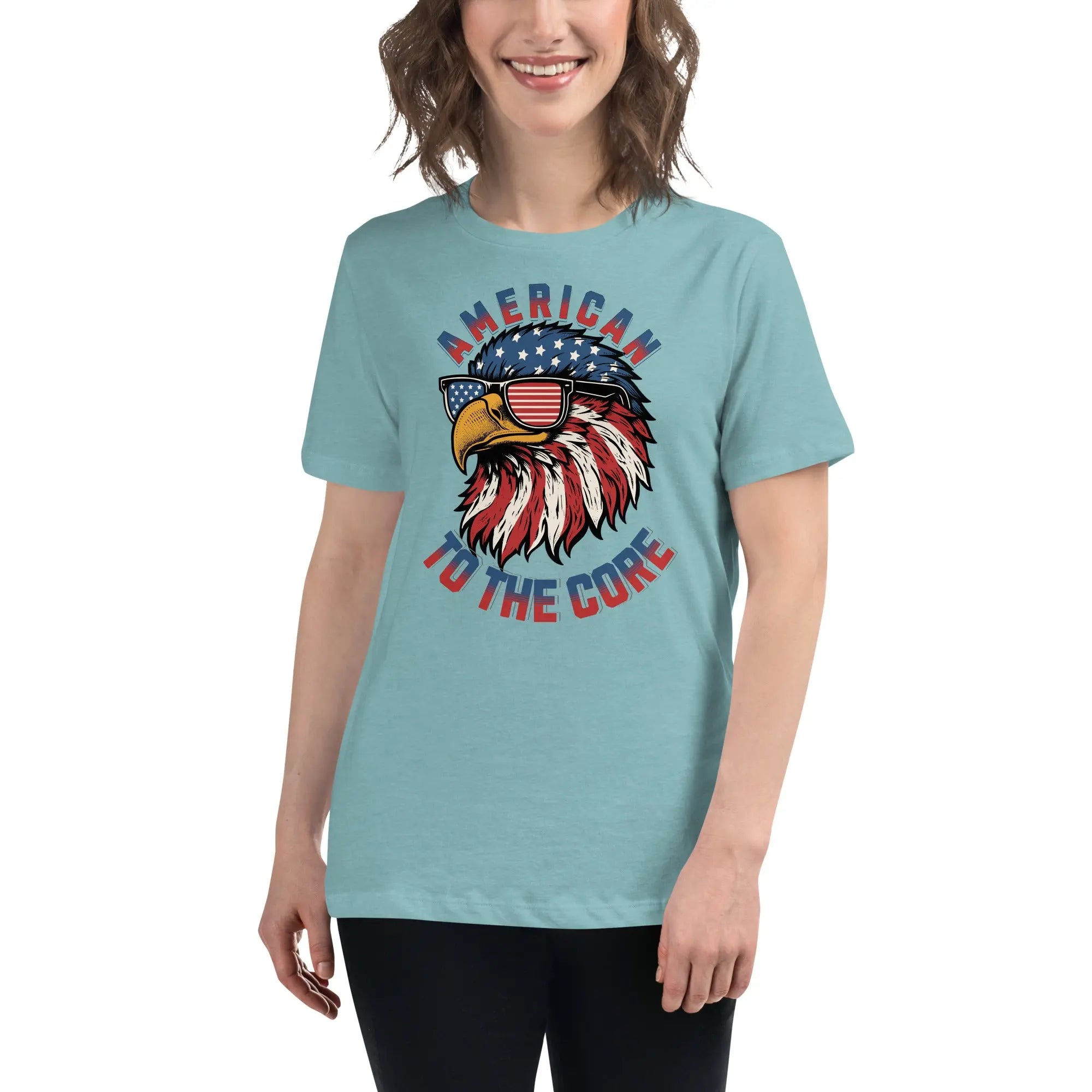 Back of woman wearing a heather blue lagoon patriotic t-shirt with an eagle head and  "American To The Core" text