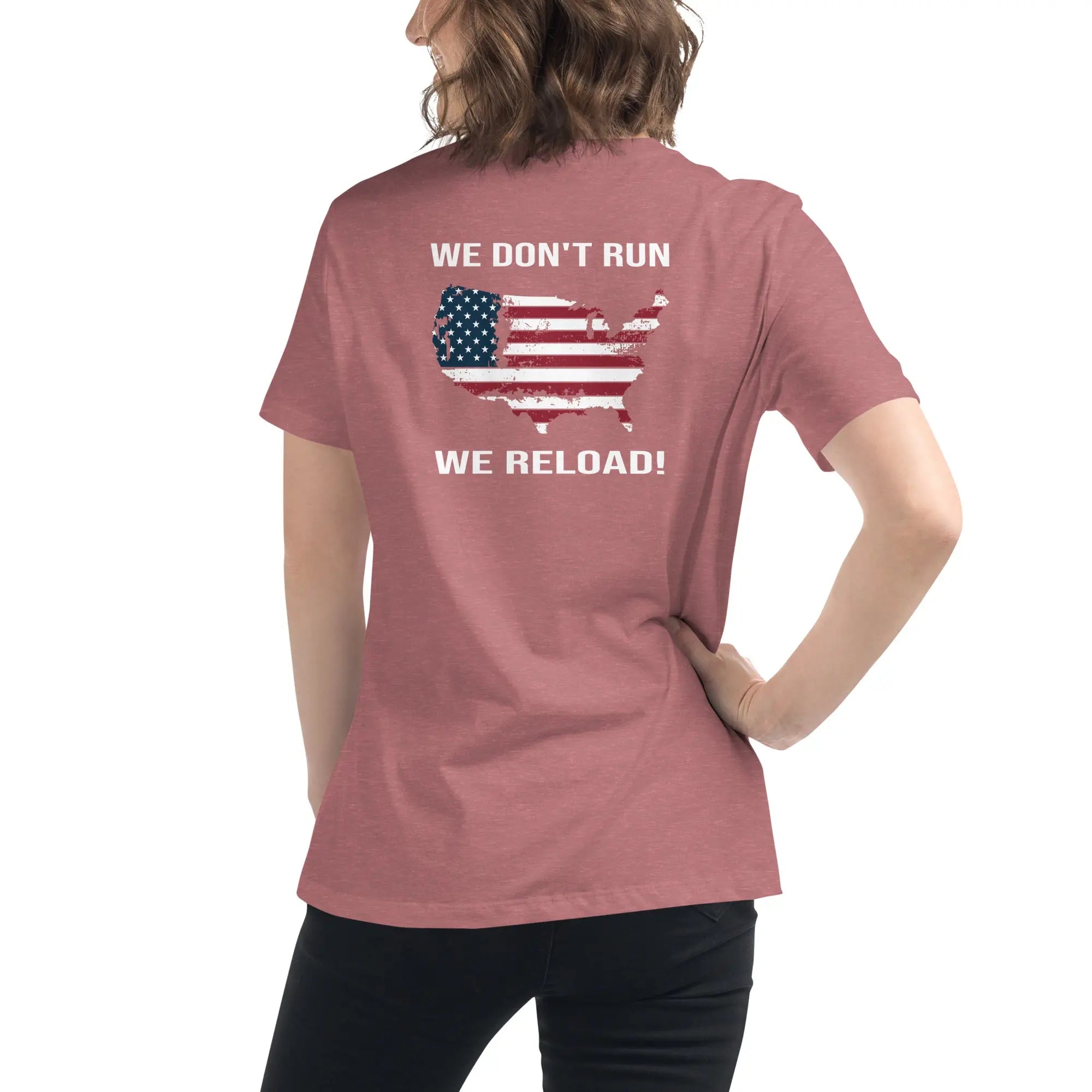 Back of woman wearing a heather mauve patriotic t-shirt with a silhouette of America and  "We Don't Run, We Reload" text
