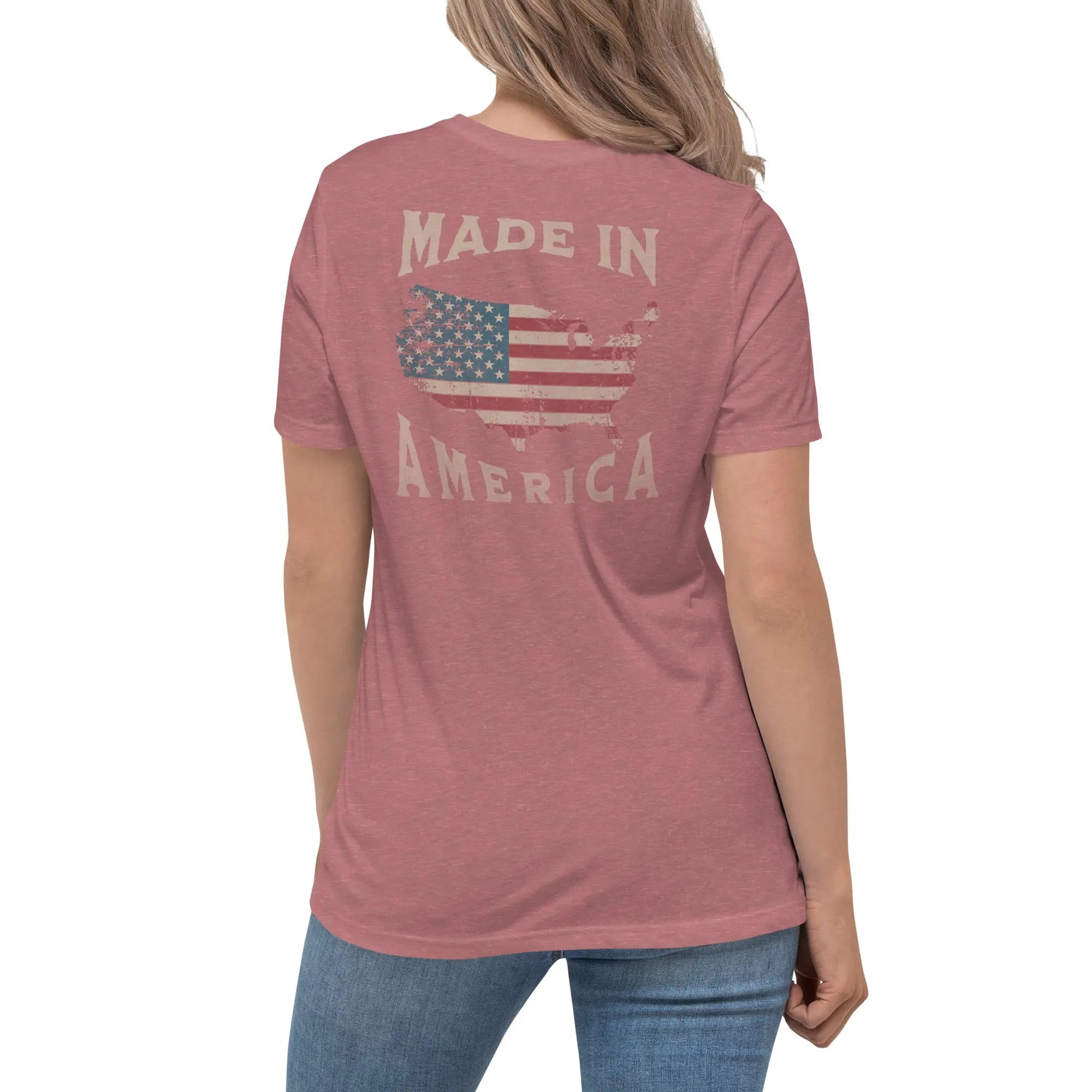 Back of woman wearing a heather mauve patriotic t-shirt with silhouette of America and  "Made In America" text