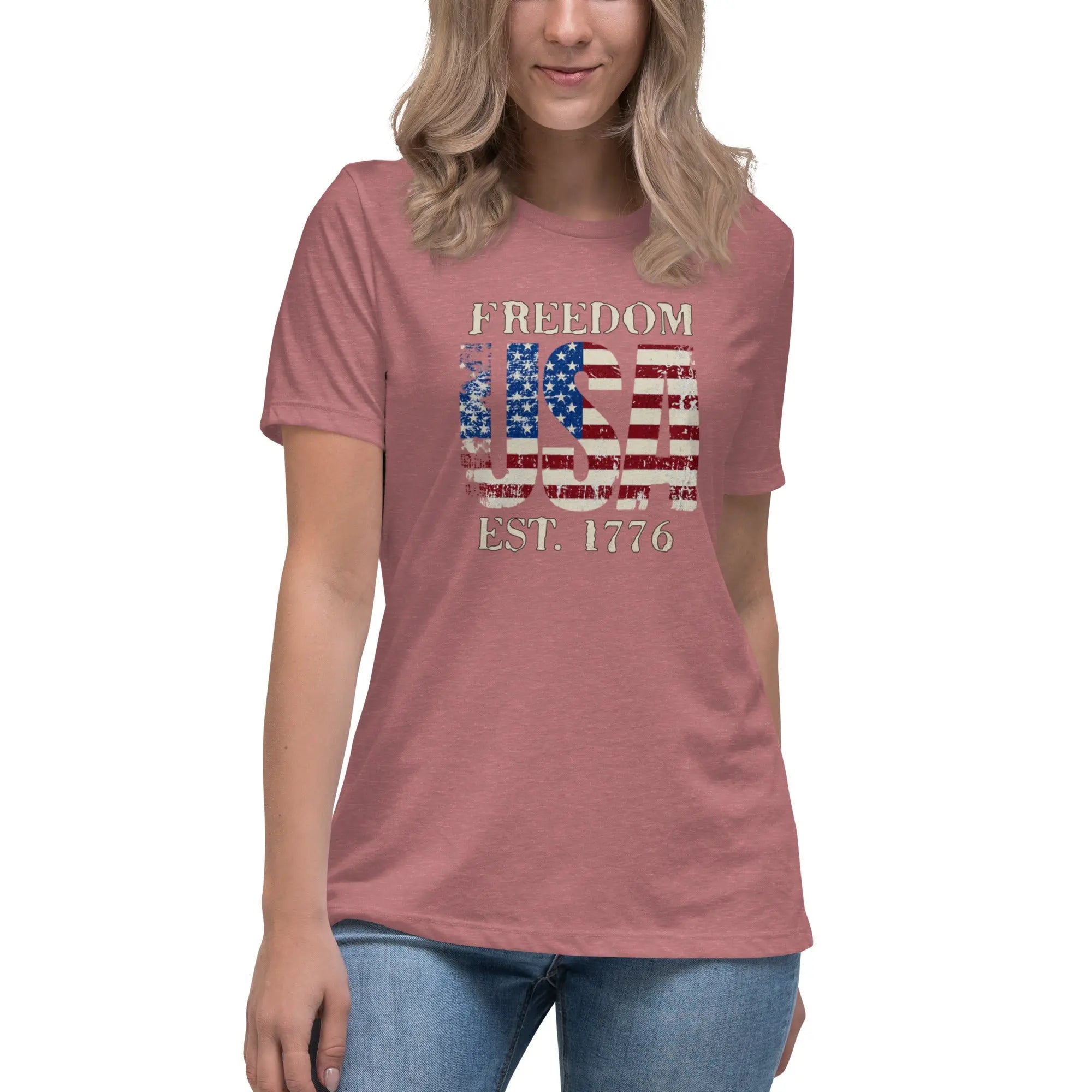 Back of woman wearing a heather mauve patriotic t-shirt with  "Freedom USA Est. 1776" text