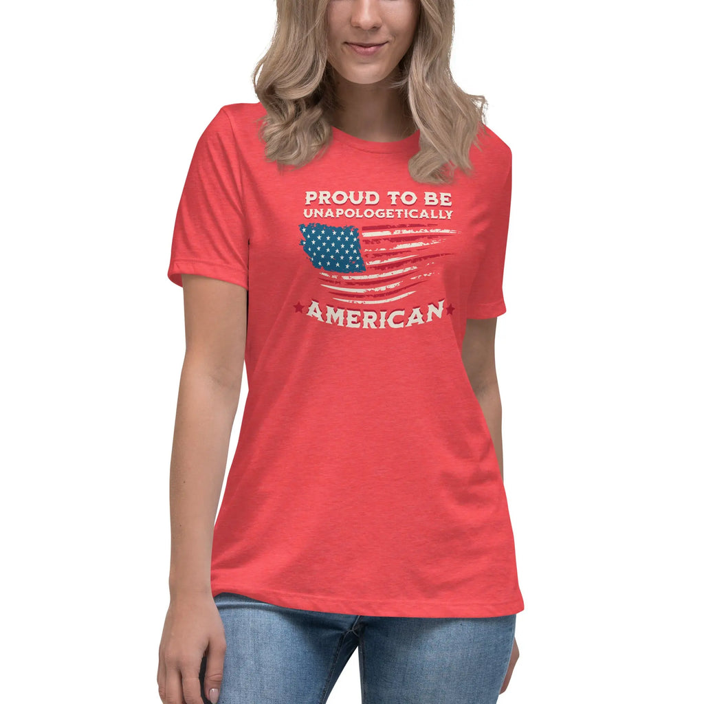 A woman wearing a heather red patriotic t-shirt with the American flag and "Proud To Be Unapologetically American" text.
