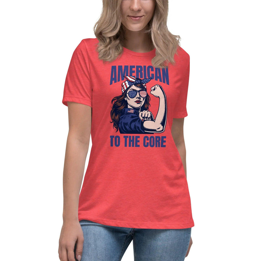 A woman wearing a heather red, patriotic t-shirt with a strong woman and "American To The Core" text.