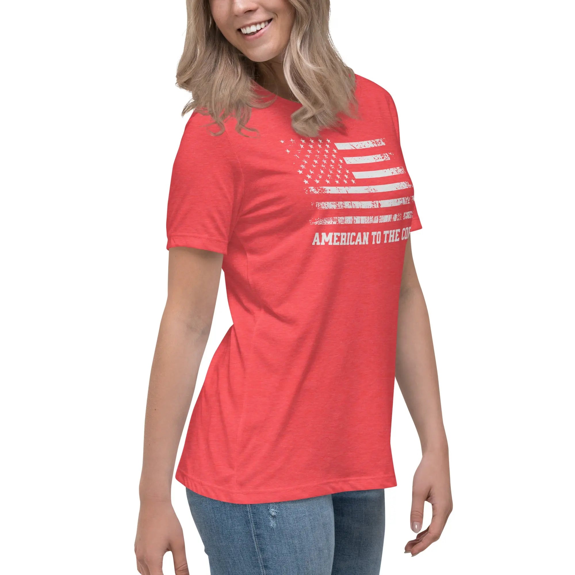 A woman wearing a patriotic heather red t-shirt with the American flag in black and white and "American to the core" text