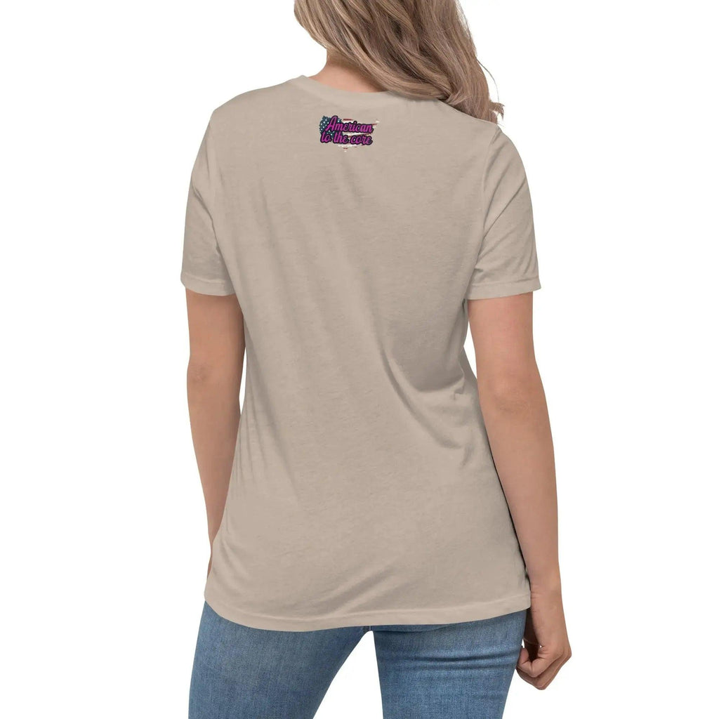 Back of a woman wearing a heather stone patriotic t-shirt with the text "American To The Core"